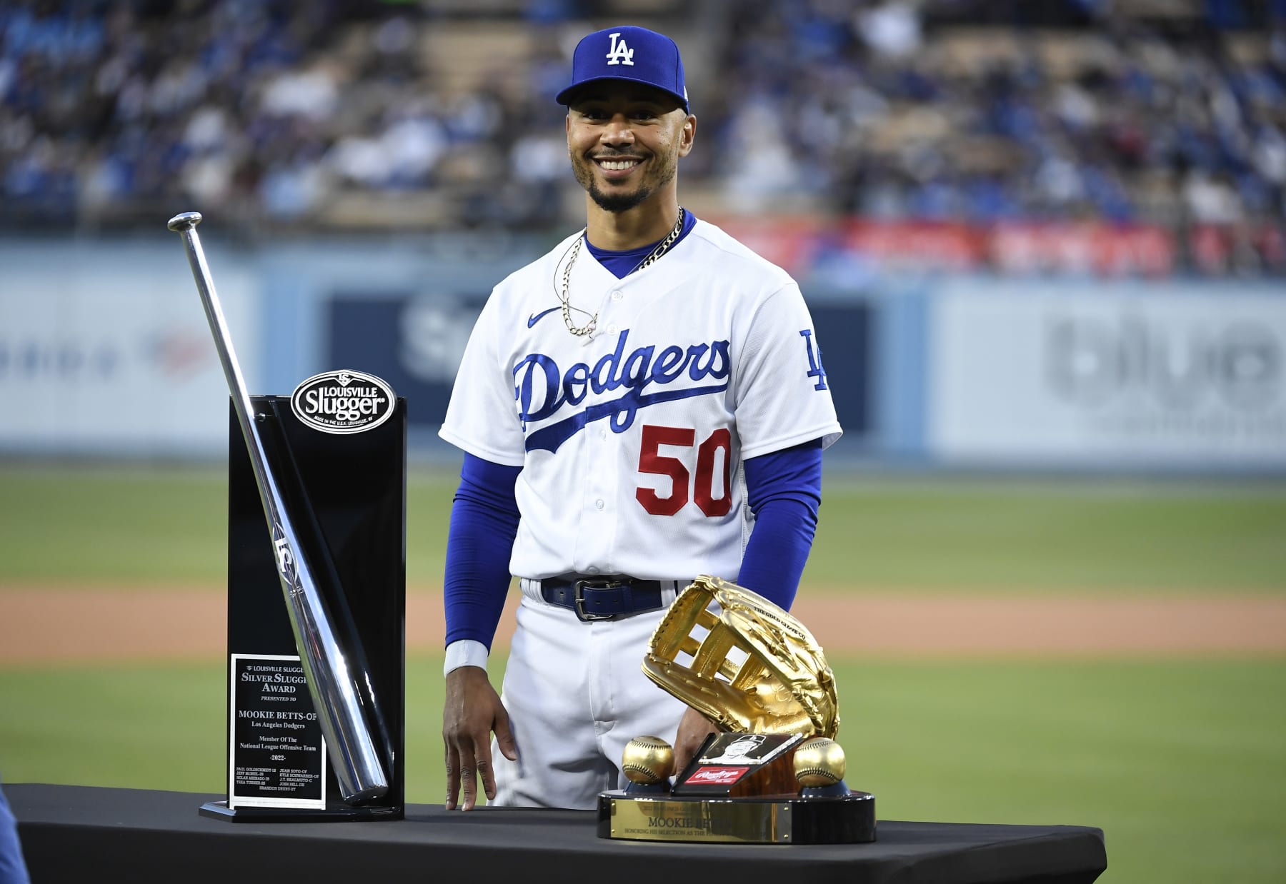 LOS ANGELES, CA - APRIL 04: Mookie Betts #50 of the Los Angeles Dodgers receives the 2022 Silver Slugger and Golden Glove awards before the start of the game against the Colorado Rockies during the first inning at Dodger Stadium on April 4, 2023 in Los Angeles, California. (Photo by Kevork Djansezian/Getty Images)