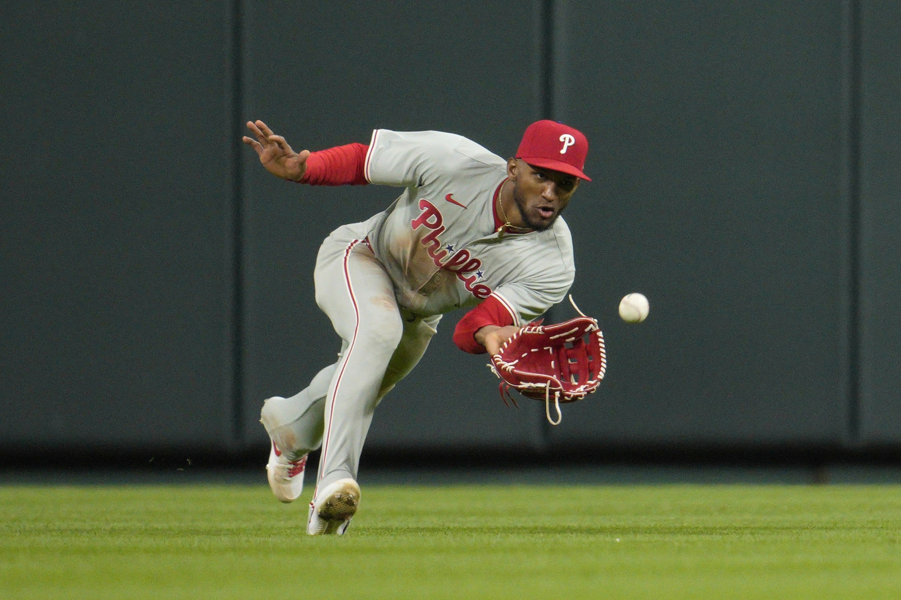 CINCINNATI, OHIO - APRIL 22: Johan Rojas #18 of the Philadelphia Phillies catches a line drive hit by Stuart Fairchild #17 of the Cincinnati Reds during the ninth inning of a baseball game at Great American Ball Park on April 22, 2024 in Cincinnati, Ohio. (Photo by Jeff Dean/Getty Images)