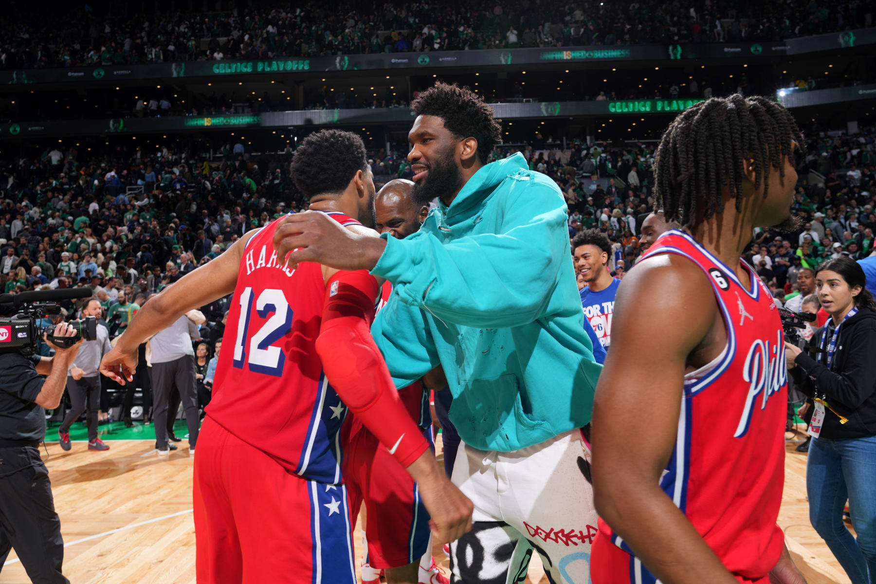 BOSTON, MA - MAY 1: Joel Embiid #21 of the Philadelphia 76ers embraces Tobias Harris #12 of the Philadelphia 76ers after the game against the Boston Celtics after Round 2 Game 1 of the 2023 NBA Playoffs on May 1, 2023 at the TD Garden in Boston, Massachusetts. NOTE TO USER: User expressly acknowledges and agrees that, by downloading and or using this photograph, User is consenting to the terms and conditions of the Getty Images License Agreement. Mandatory Copyright Notice: Copyright 2023 NBAE  (Photo by Jesse D. Garrabrant/NBAE via Getty Images)