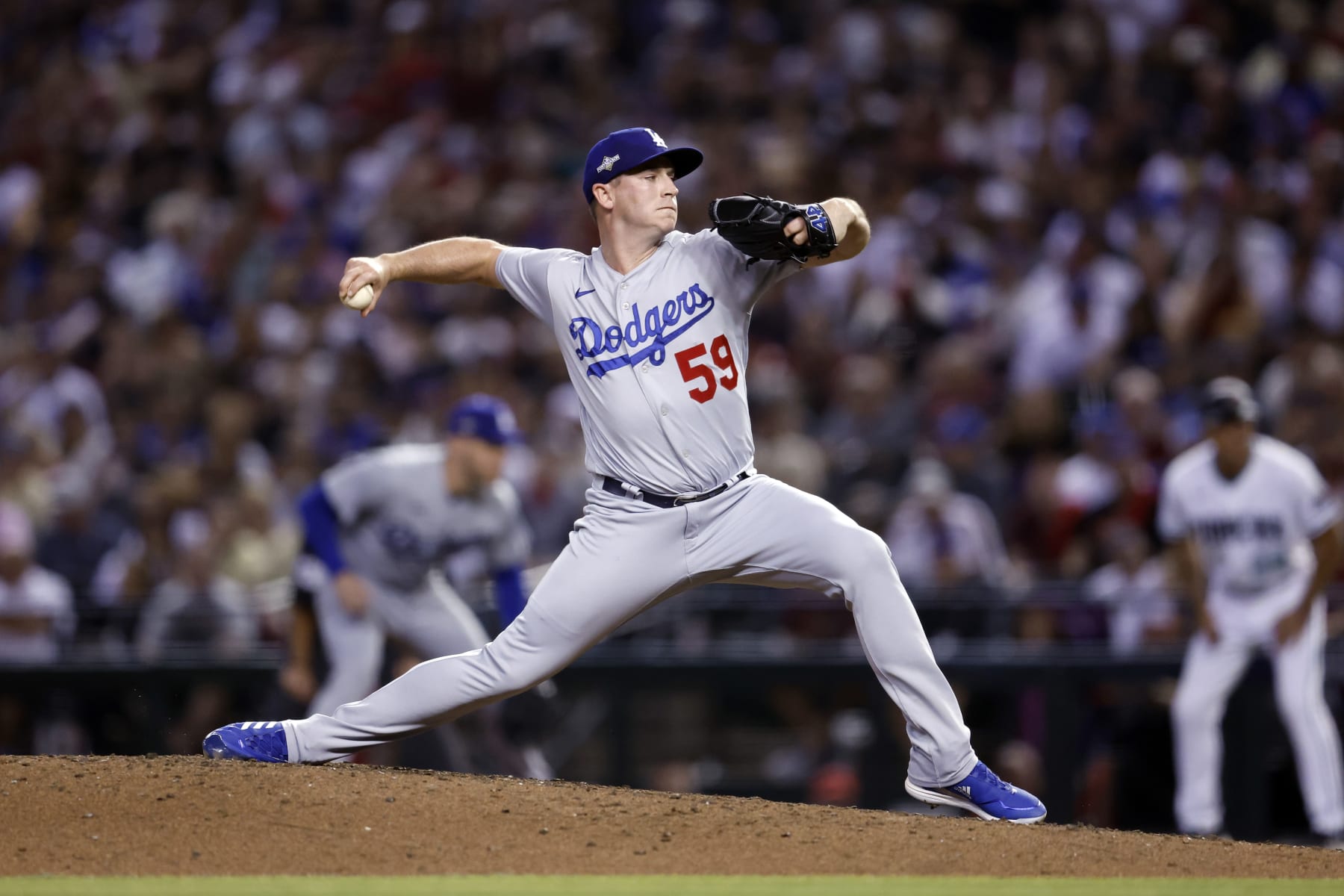 PHOENIX, AZ - OCTOBER 11: Evan Phillips #59 of the Los Angeles Dodgers pitches during Game 3 of the Division Series between the Los Angeles Dodgers and the Arizona Diamondbacks at Chase Field on Wednesday, October 11, 2023 in Phoenix, Arizona. (Photo by Chris Coduto/MLB Photos via Getty Images)