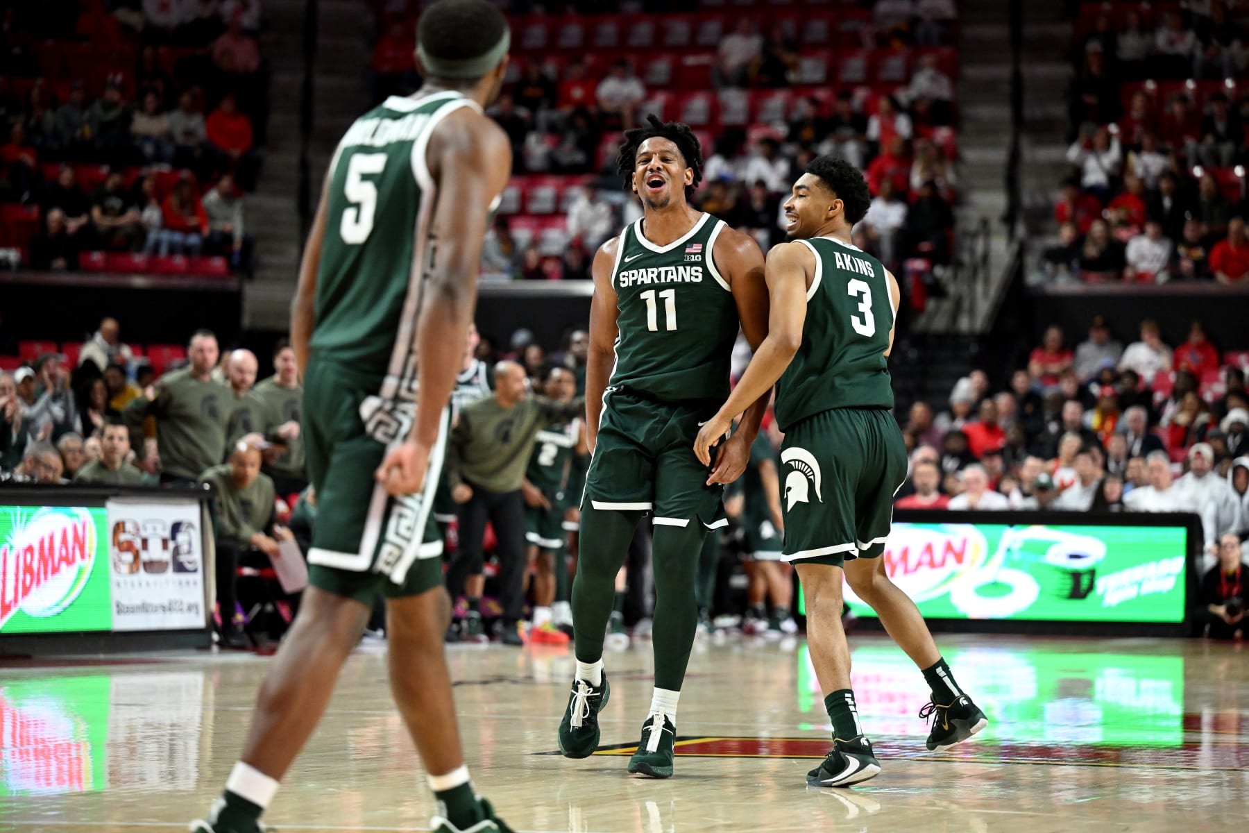 COLLEGE PARK, MARYLAND - JANUARY 21: A.J. Hoggard #11 of the Michigan State Spartans celebrates with Jaden Akins #3 during the game against the Maryland Terrapins at Xfinity Center on January 21, 2024 in College Park, Maryland. (Photo by G Fiume/Getty Images)