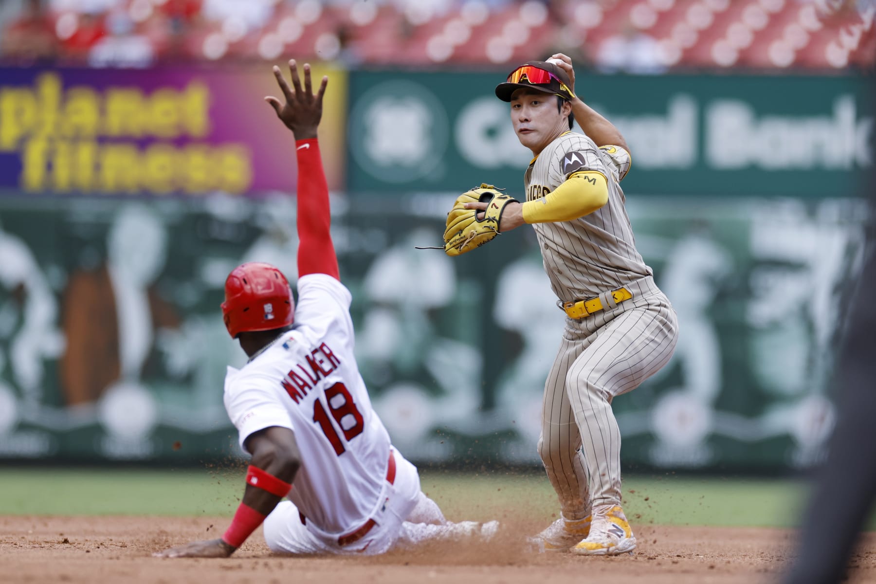 ST. LOUIS, MO - AUGUST 30: San Diego Padres second baseman Ha-Seong Kim (7) throws to first to turn a double play over the slide by St. Louis Cardinals right fielder Jordan Walker (18) during an MLB game on August 30, 2023 at Busch Stadium in St. Louis, Missouri. (Photo by Joe Robbins/Icon Sportswire via Getty Images)