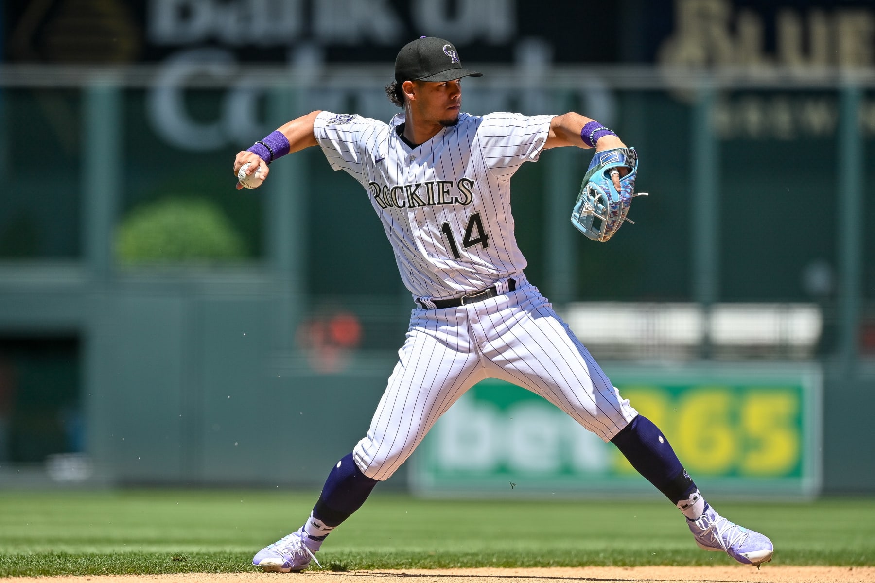 DENVER, CO - JUNE 25: Ezequiel Tovar #14 of the Colorado Rockies throws to first base after fielding a ground ball in a game against the Los Angeles Angels at Coors Field on June 25, 2023 in Denver, Colorado. (Photo by Dustin Bradford/Getty Images)