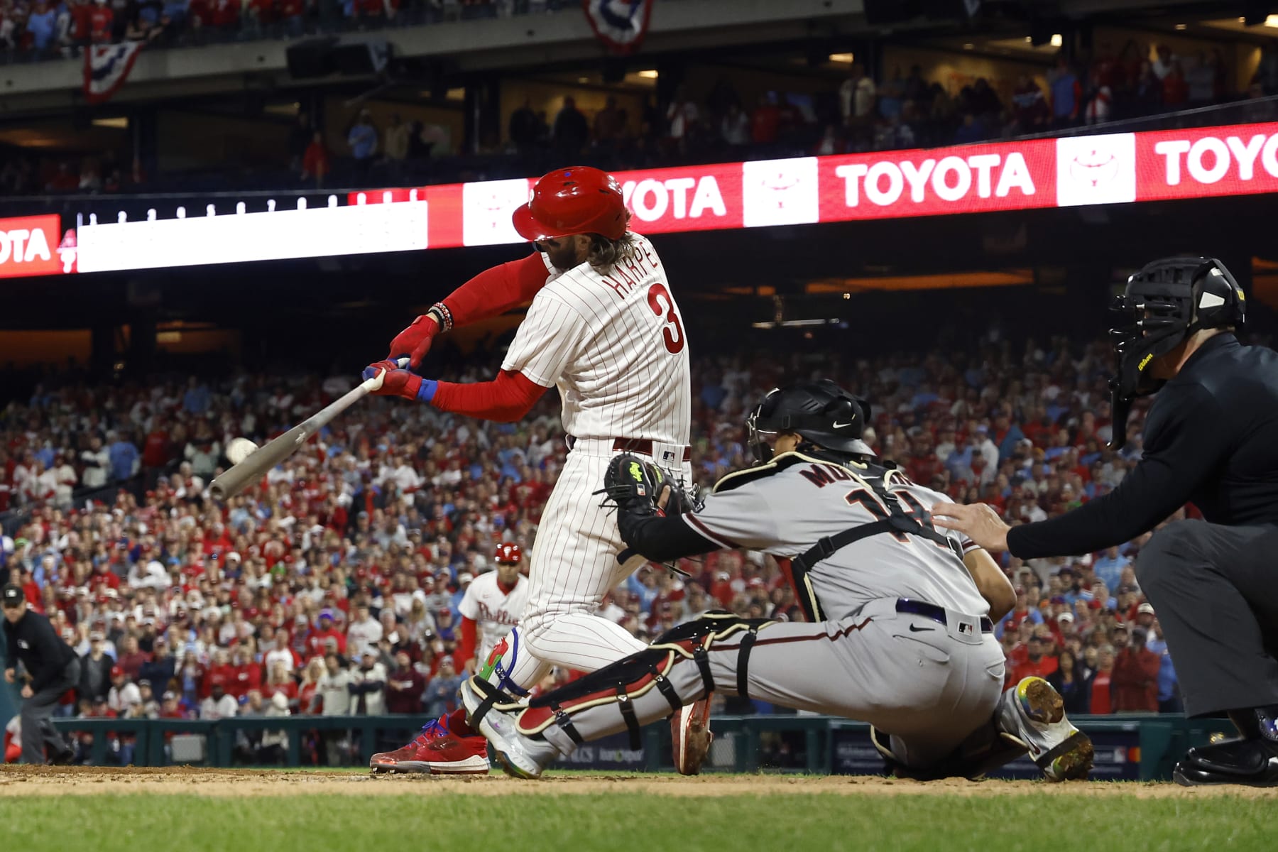 PHILADELPHIA, PENNSYLVANIA - OCTOBER 17: Bryce Harper #3 of the Philadelphia Phillies takes a at bat in front of Gabriel Moreno #14 of the Arizona Diamondbacks during Game Two of the Championship Series at Citizens Bank Park on October 17, 2023 in Philadelphia, Pennsylvania. (Photo by Sarah Stier/Getty Images)
