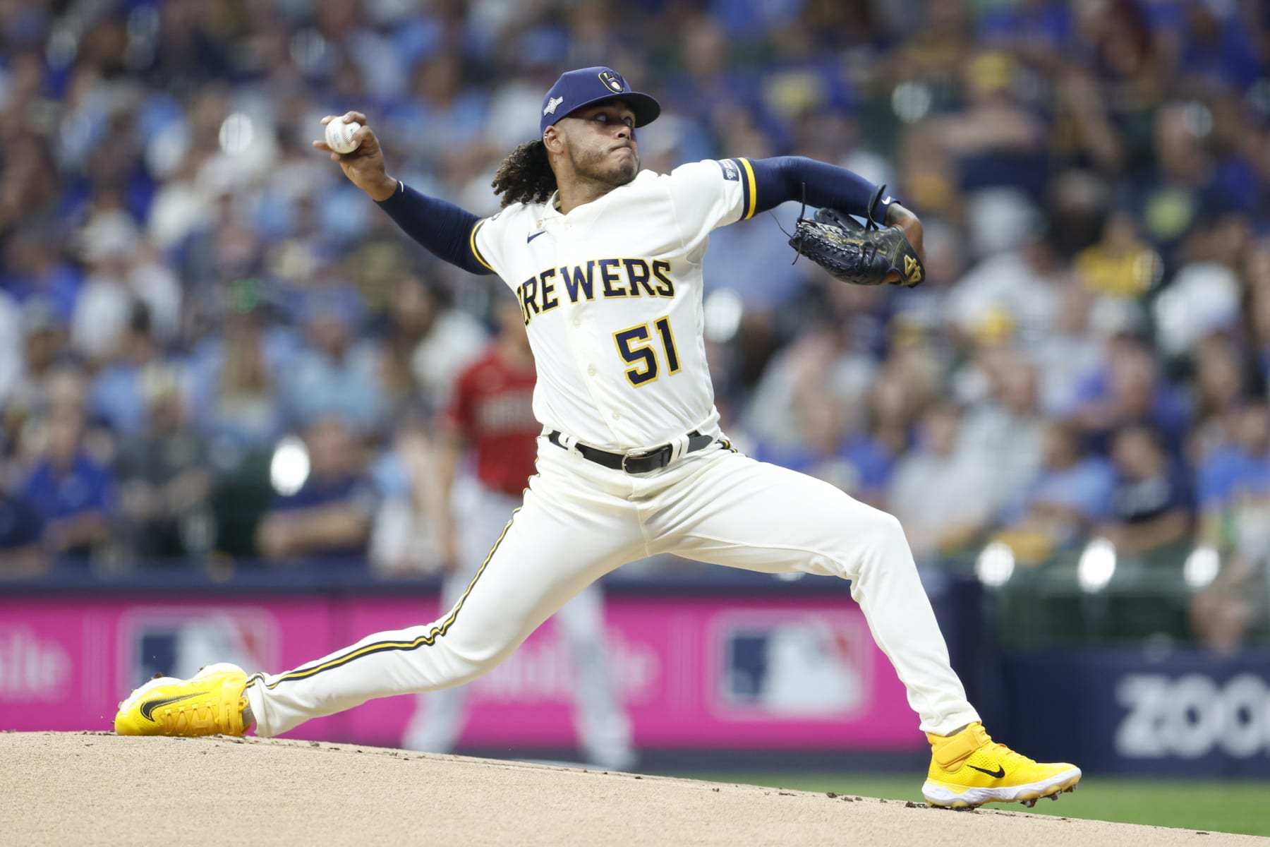 MILWAUKEE, WISCONSIN - OCTOBER 04: Freddy Peralta #51 of the Milwaukee Brewers delivers during the first inning against the Arizona Diamondbacks during Game Two of the Wild Card Series at American Family Field on October 04, 2023 in Milwaukee, Wisconsin. (Photo by John Fisher/Getty Images)