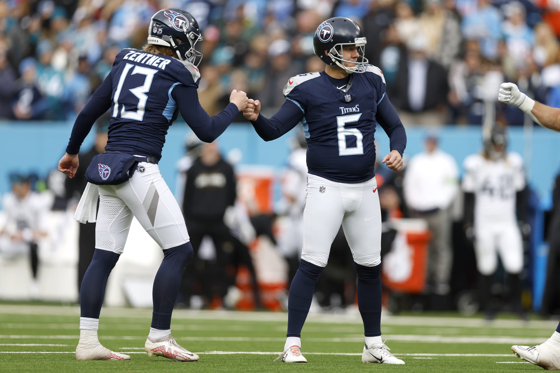 NASHVILLE, TENNESSEE - JANUARY 07: Nick Folk #6 and Ty Zentner #13 of the Tennessee Titans celebrate an extra point during the first half against the Jacksonville Jaguars at Nissan Stadium on January 07, 2024 in Nashville, Tennessee. (Photo by Wesley Hitt/Getty Images) NASHVILLE, TENNESSEE - JANUARY 07: Nick Folk #6 and Ty Zentner #13 of the Tennessee Titans celebrate an extra point during the first half against the Jacksonville Jaguars at Nissan Stadium on January 07, 2024 in Nashville, Tennessee. (Photo by Wesley Hitt/Getty Images)