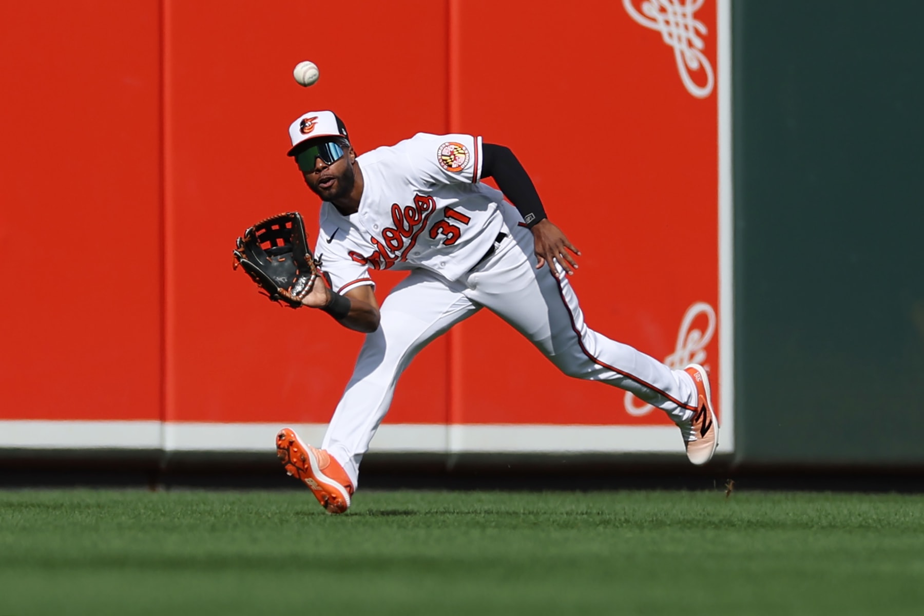 BALTIMORE, MARYLAND - OCTOBER 07: Cedric Mullins #31 of the Baltimore Orioles catches a fly ball hit by Leody Taveras #3 of the Texas Rangers during the third inning of Game One of the American League Division Series at Oriole Park at Camden Yards on October 07, 2023 in Baltimore, Maryland. (Photo by Patrick Smith/Getty Images)