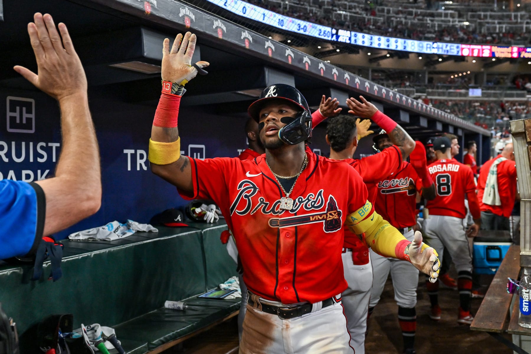 ATLANTA, GA  JUNE 30:  Atlanta right fielder Ronald Acuna Jr. (13) gets high-fives in the dugout following his home run during the MLB game between the Miami Marlins and the Atlanta Braves on June 30th, 2023 at Truist Park in Atlanta, GA. (Photo by Rich von Biberstein/Icon Sportswire via Getty Images)