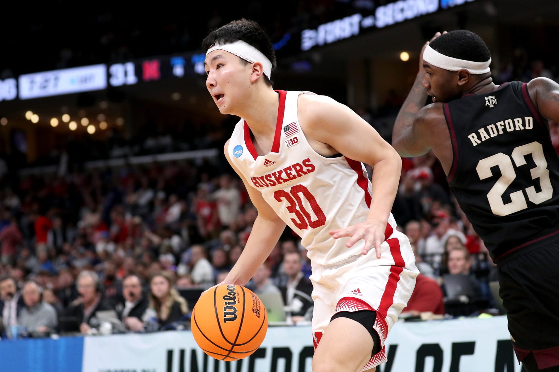 MEMPHIS, TENNESSEE - MARCH 22:  Keisei Tominaga #30 of the Nebraska Cornhuskers drives to the basket against Tyrece Radford #23 of the Texas A&M Aggies during the first half in the first round of the NCAA Men's Basketball Tournament at FedExForum on March 22, 2024 in Memphis, Tennessee. (Photo by Justin Ford/Getty Images)