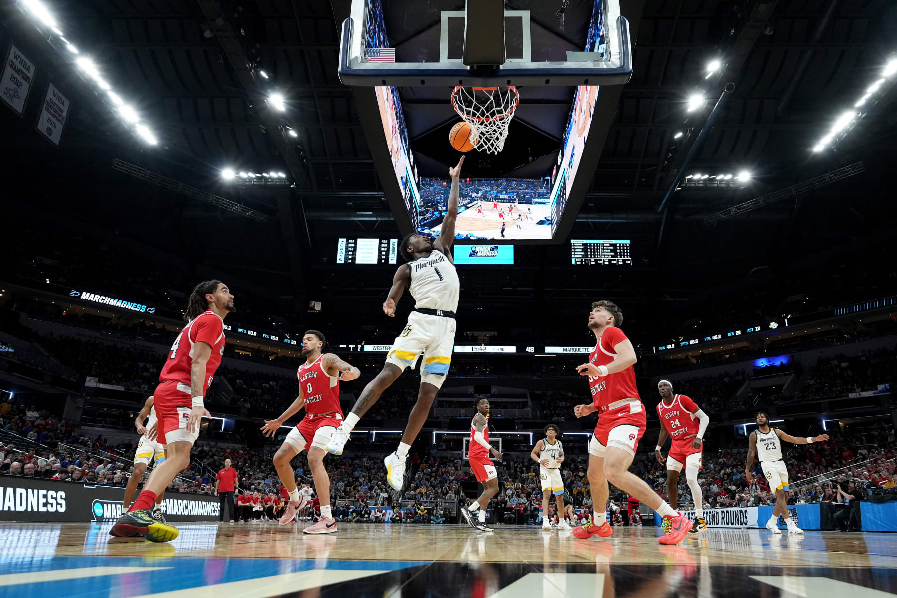 INDIANAPOLIS, INDIANA - MARCH 22: Kam Jones #1 of the Marquette Golden Eagles shoots the ball against the Western Kentucky Hilltoppers during the second half in the first round of the NCAA Men's Basketball Tournament at Gainbridge Fieldhouse on March 22, 2024 in Indianapolis, Indiana. (Photo by Dylan Buell/Getty Images)