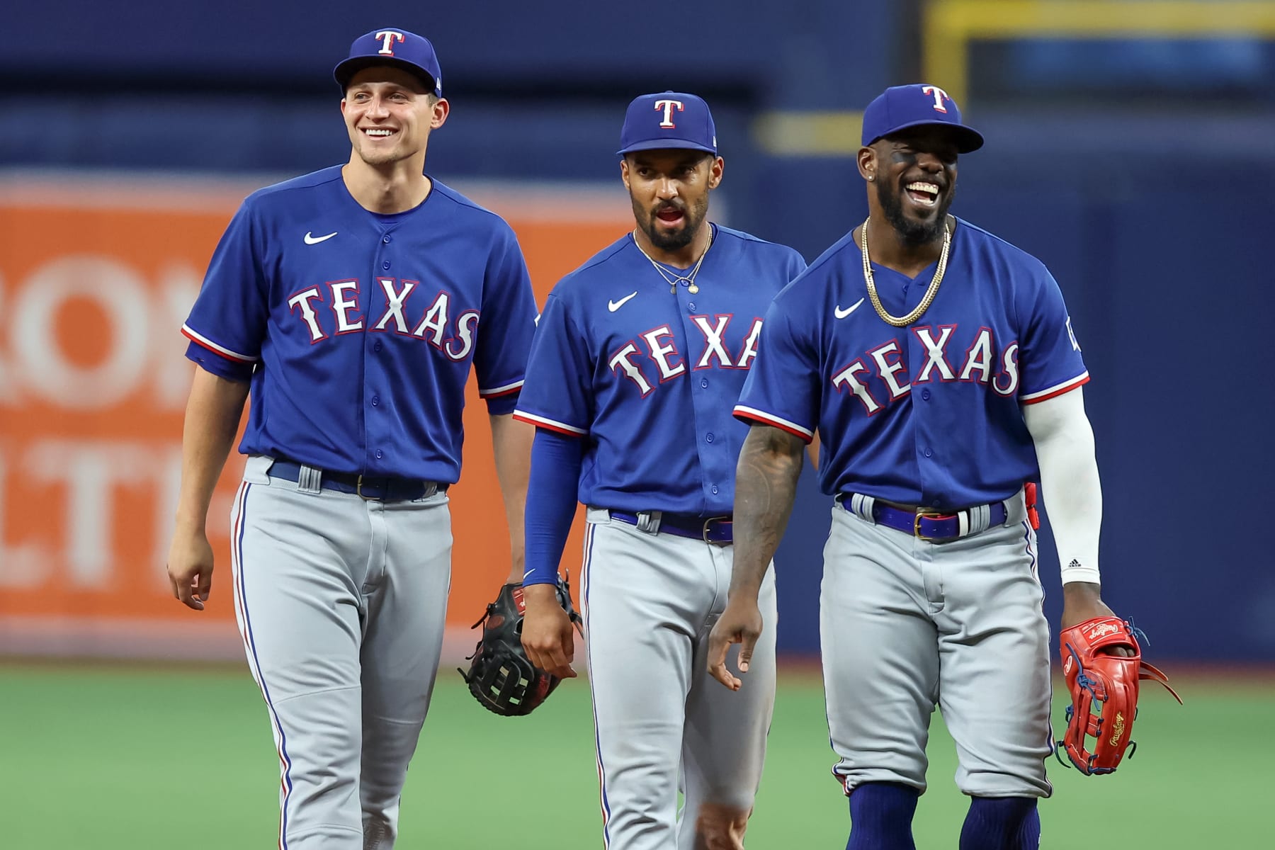 ST. PETERSBURG, FL - JUNE 10: (L-R) Corey Seager #5, Marcus Semien #2 and Adolis Garcia #53 of the Texas Rangers celebrate the 8-4 win over the Tampa Bay Rays at Tropicana Field on June 10, 2023 in St. Petersburg, Florida. (Photo by Mike Carlson/Getty Images)
