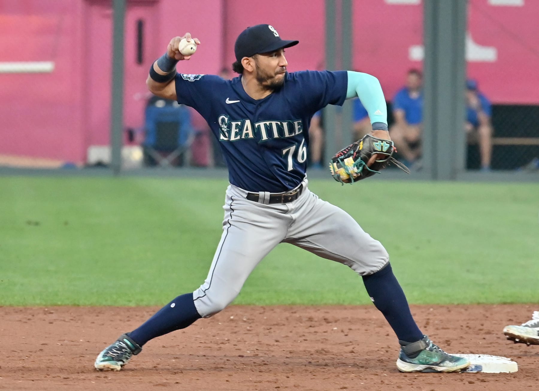 KANSAS CITY, MO - AUGUST 15: Seattle Mariners shortstop Jose Caballero (76) throws to first to com[lete a double play during a MLB game between the Seattle Mariners and the Kansas City Royals on August 15, 2023, at Kauffman Stadium in Kansas City. (Photo by Keith Gillett/Icon Sportswire via Getty Images)