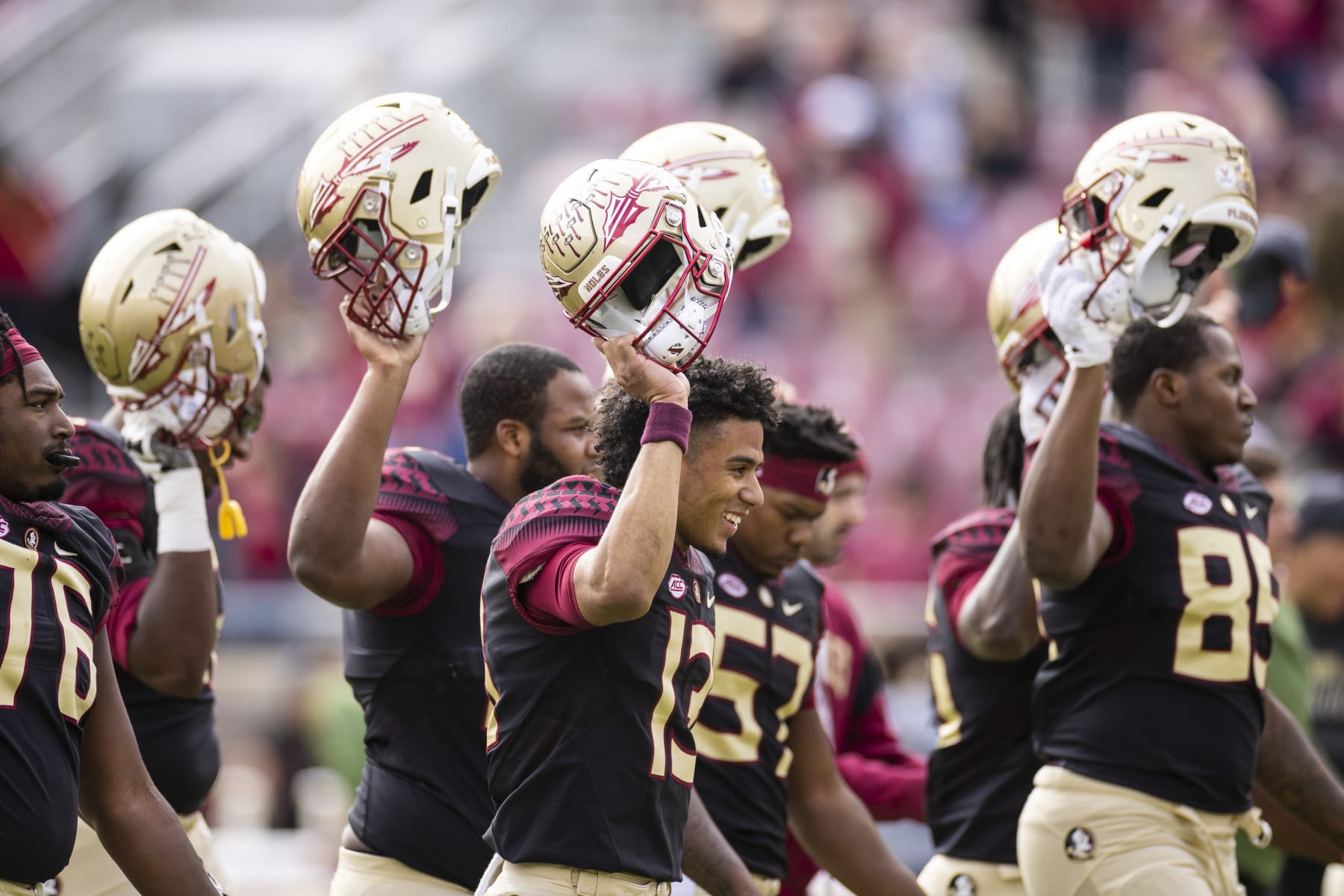 TALLAHASSEE, FLORIDA - NOVEMBER 19: Jordan Travis #13 of the Florida State Seminoles holds up his helmet during warms up before the start of a game against the Louisiana-Lafayette Ragin Cajuns at Doak Campbell Stadium on November 19, 2022 in Tallahassee, Florida. (Photo by James Gilbert/Getty Images)