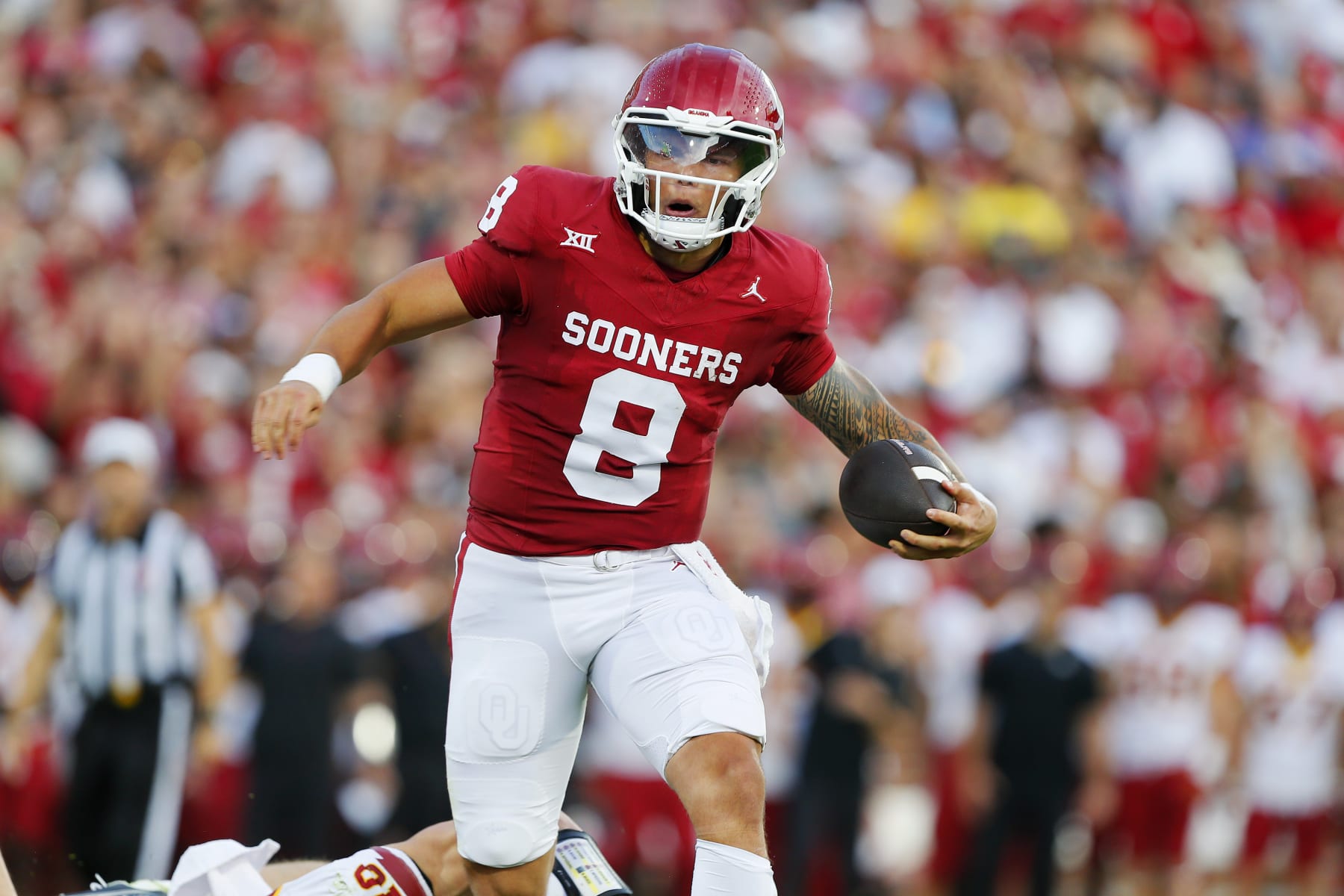 NORMAN, OKLAHOMA - SEPTEMBER 30:  Quarterback Dillon Gabriel #8 of the Oklahoma Sooners breaks past a tackle to score a one-yard touchdown against the Iowa State Cyclones in the first quarter at Gaylord Family Oklahoma Memorial Stadium on September 30, 2023 in Norman, Oklahoma.  Oklahoma won 50-20. (Photo by Brian Bahr/Getty Images)