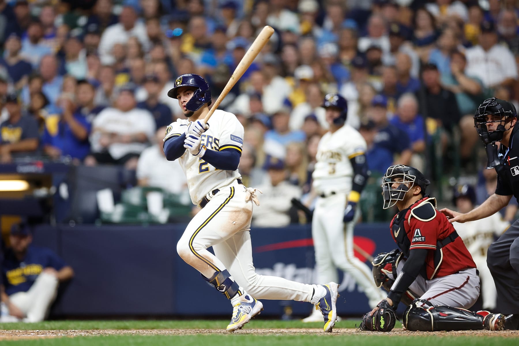MILWAUKEE, WISCONSIN - OCTOBER 03: Willy Adames #27 of the Milwaukee Brewers hits an infield single against the Arizona Diamondbacks during Game One of the Wild Card Series at American Family Field on October 03, 2023 in Milwaukee, Wisconsin. (Photo by John Fisher/Getty Images)
