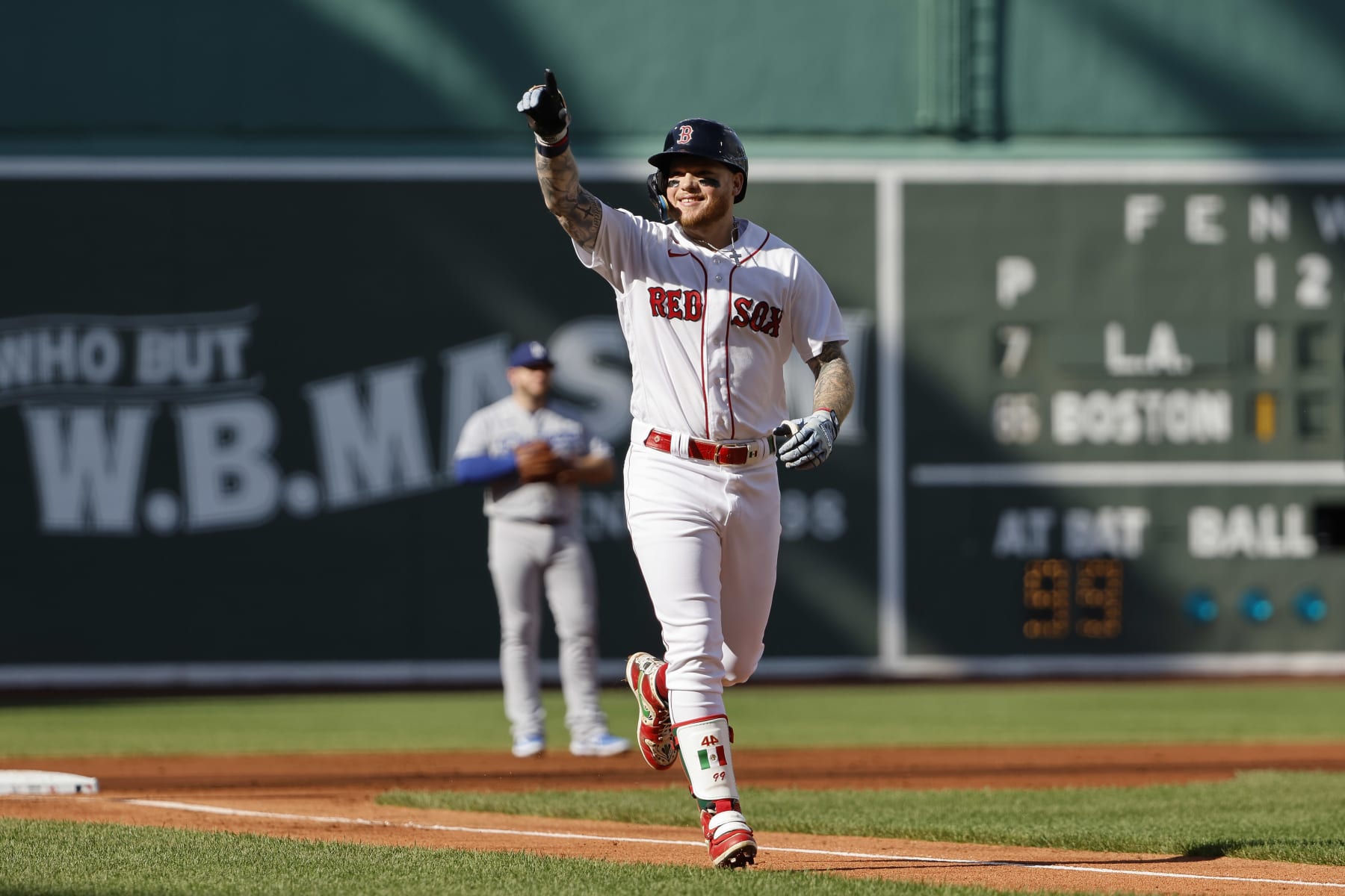 BOSTON, MA - AUGUST 26: Alex Verdugo #99 of the Boston Red Sox points to the stands after his lead-off home run against the Los Angeles Dodgers during the first inning at Fenway Park on August 26, 2023 in Boston, Massachusetts. (Photo By Winslow Townson/Getty Images)