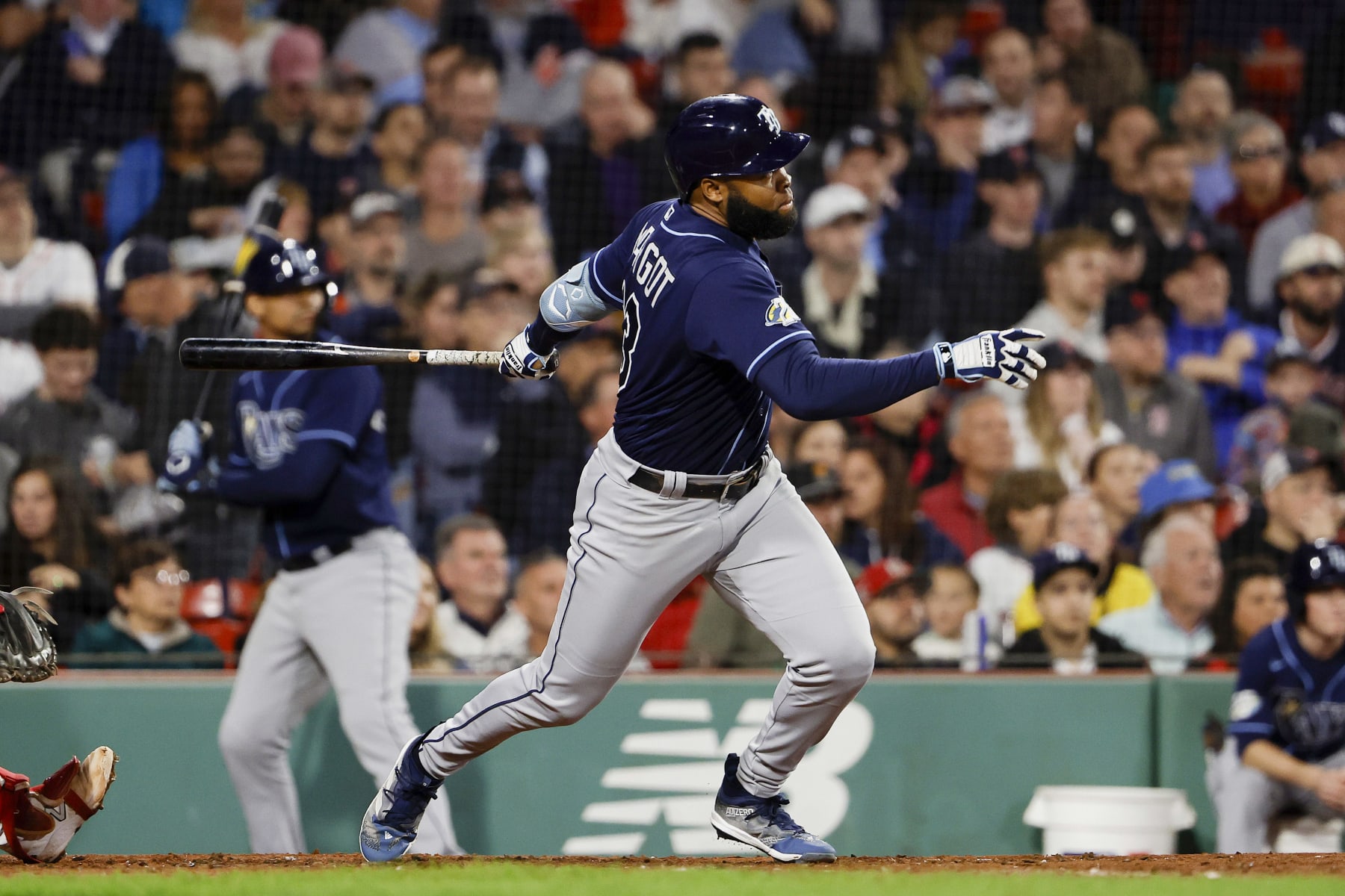 BOSTON, MA - SEPTEMBER 27: Manuel Margot #13 of the Tampa Bay Rays follows through on his RBI double against the Boston Red Sox during the fourth inning at Fenway Park on September 27, 2023 in Boston, Massachusetts. (Photo By Winslow Townson/Getty Images)