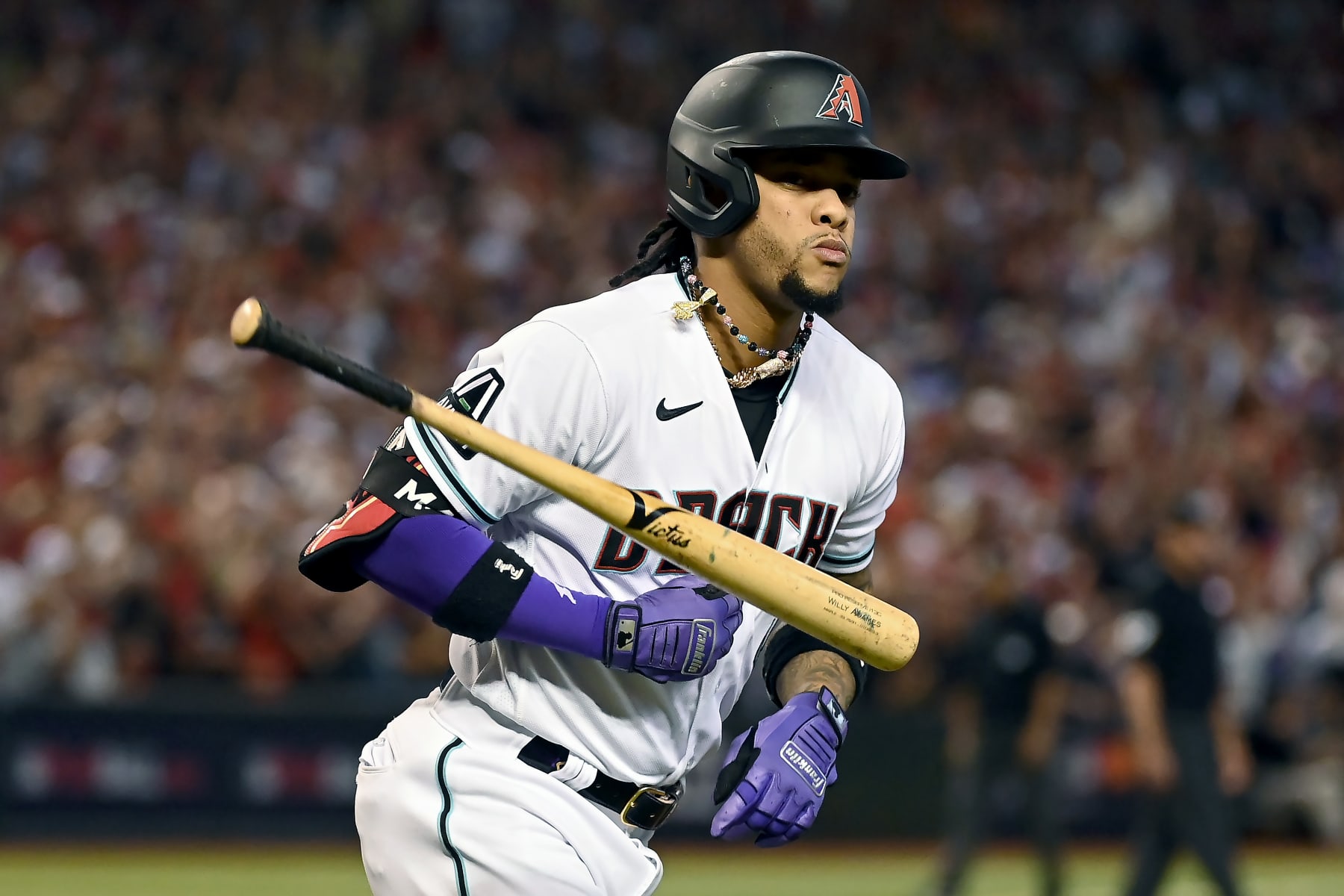 PHOENIX, ARIZONA - OCTOBER 11: Ketel Marte #4 of the Arizona Diamondbacks tosses his bat after hitting a home run in the third inning against the Los Angeles Dodgers during Game Three of the Division Series at Chase Field on October 11, 2023 in Phoenix, Arizona. (Photo by Norm Hall/Getty Images)
