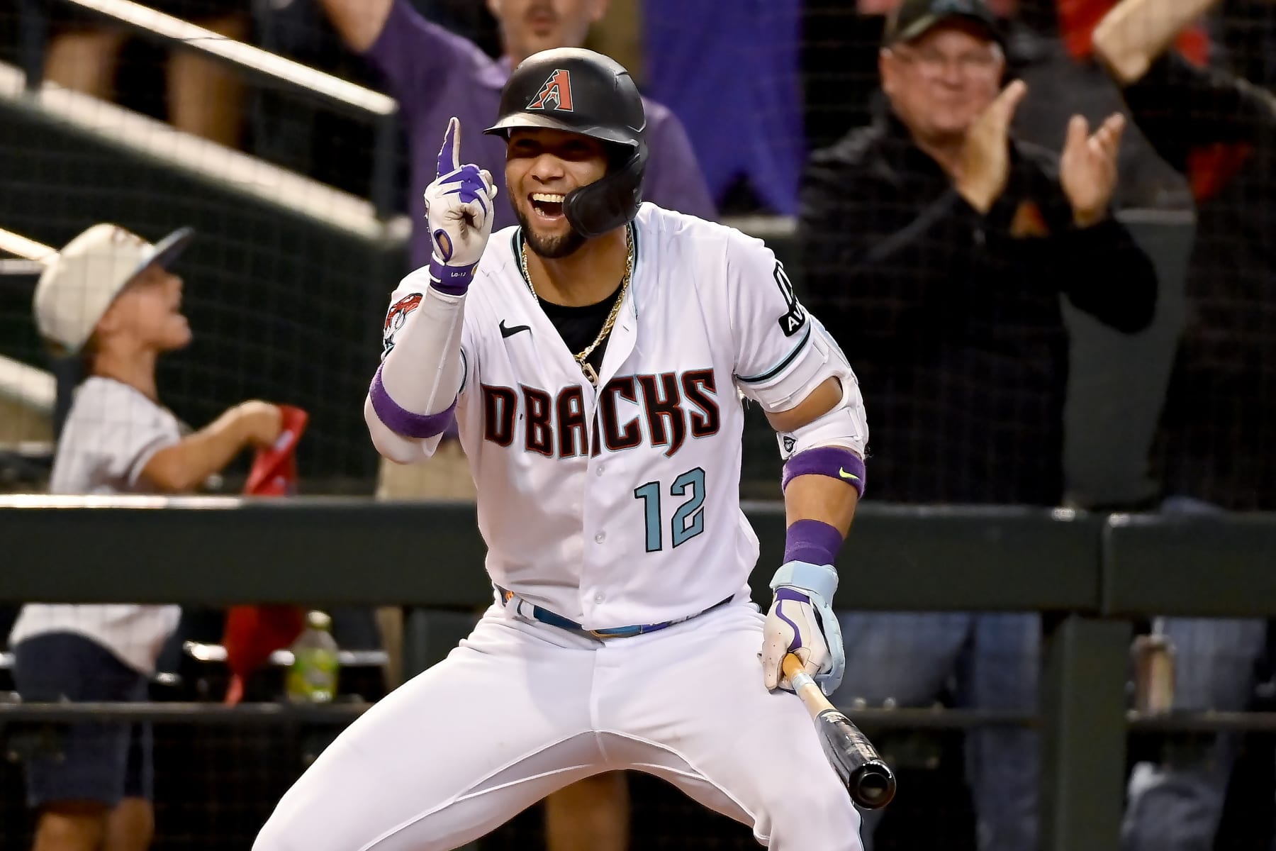 PHOENIX, ARIZONA - OCTOBER 11: Lourdes Gurriel Jr. #12 of the Arizona Diamondbacks celebrates after Gabriel Moreno #14 (not pictured) hit a home run in the third inning against the Los Angeles Dodgers during Game Three of the Division Series at Chase Field on October 11, 2023 in Phoenix, Arizona. (Photo by Norm Hall/Getty Images)