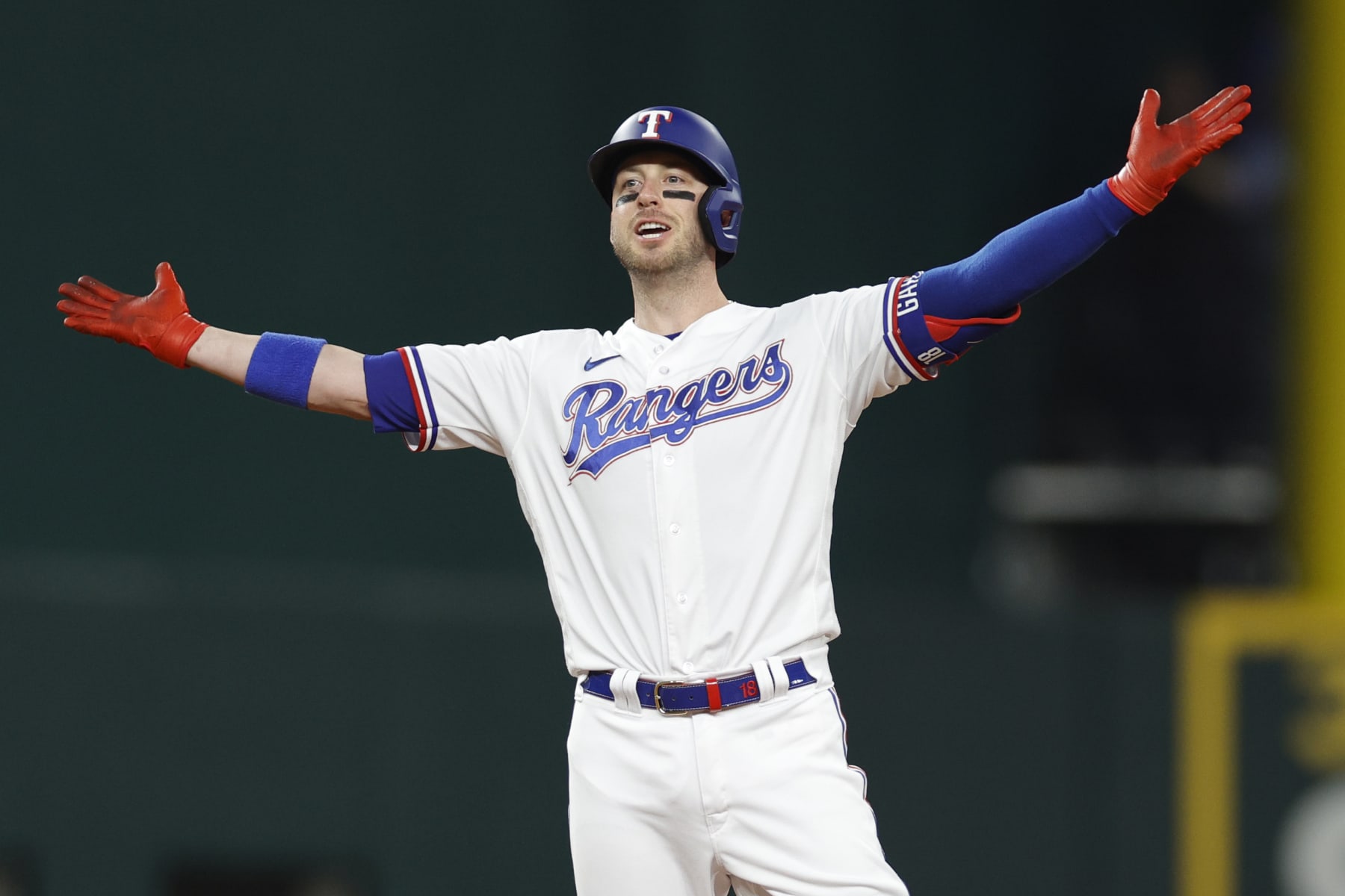 ARLINGTON, TEXAS - OCTOBER 10: Mitch Garver #18 of the Texas Rangers celebrates after hitting a two-run RBI double against the Baltimore Orioles during the second inning in Game Three of the Division Series at Globe Life Field on October 10, 2023 in Arlington, Texas. (Photo by Carmen Mandato/Getty Images)