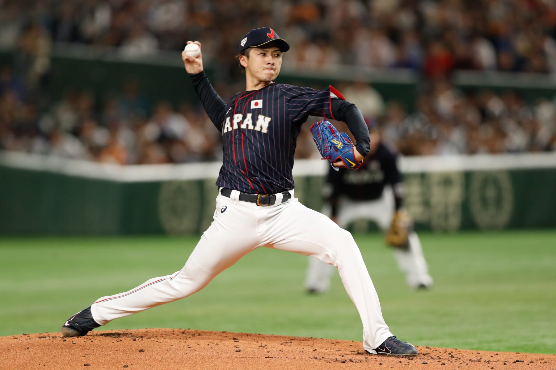 TOKYO, JAPAN - NOVEMBER 10:  Naoyuki Uwasawa #15 of Team Japan pitches during the Japan All-Star Series game against the MLB All-Stars at the Tokyo Dome on Saturday, November 10, 2018 in Tokyo, Japan. (Photo by Yuki Taguchi/MLB via Getty Images) 