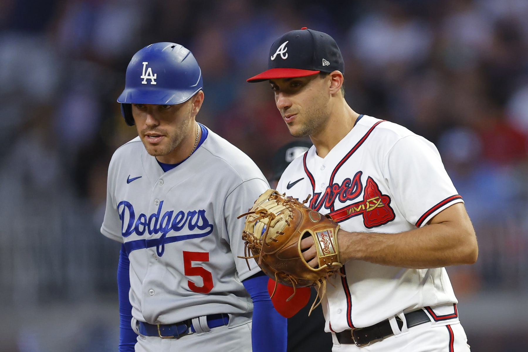 ATLANTA, GA - JUNE 26: Freddie Freeman #5 of the Los Angeles Dodgers stands at first alongside Matt Olson #28 of the Atlanta Braves during the sixth inning at Truist Park on June 26, 2022 in Atlanta, Georgia. (Photo by Todd Kirkland/Getty Images)