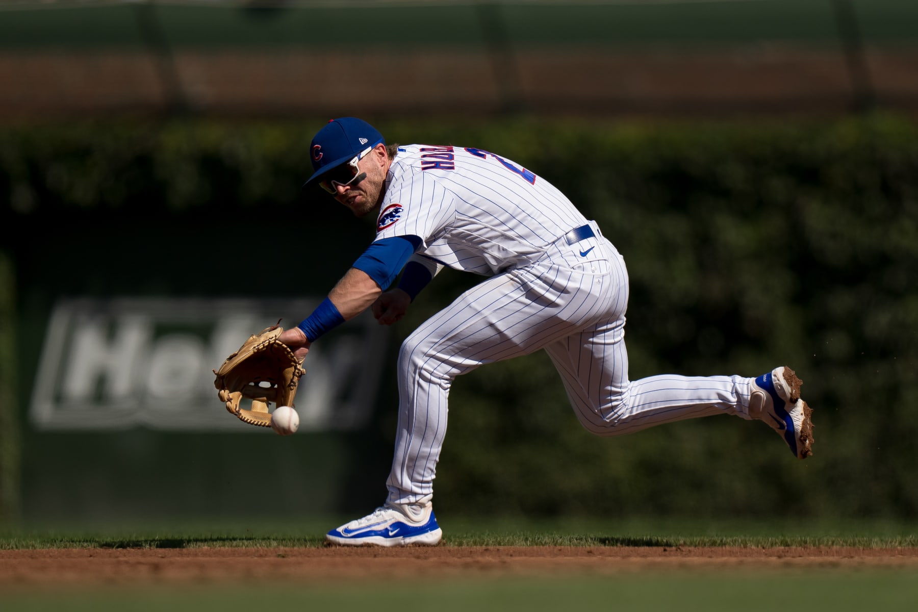 CHICAGO, IL - SEPTEMBER 23: Nico Hoerner #2 of the Chicago Cubs field a ball in a game against the Colorado Rockies at Wrigley Field on September 23, 2023 in Chicago, Illinois. (Photo by Matt Dirksen/Getty Images)