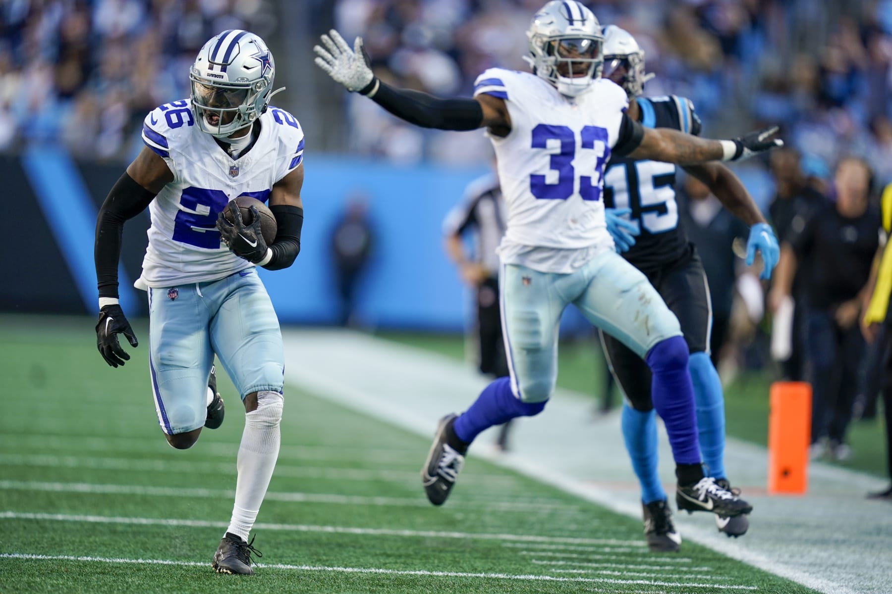 Dallas Cowboys cornerback DaRon Bland runs for a touchdown after intercepting the pass against the Carolina Panthers during the second half of an NFL football game Sunday, Nov. 19, 2023, in Charlotte, N.C. Bland scored n the play. (AP Photo/Erik Verduzco)