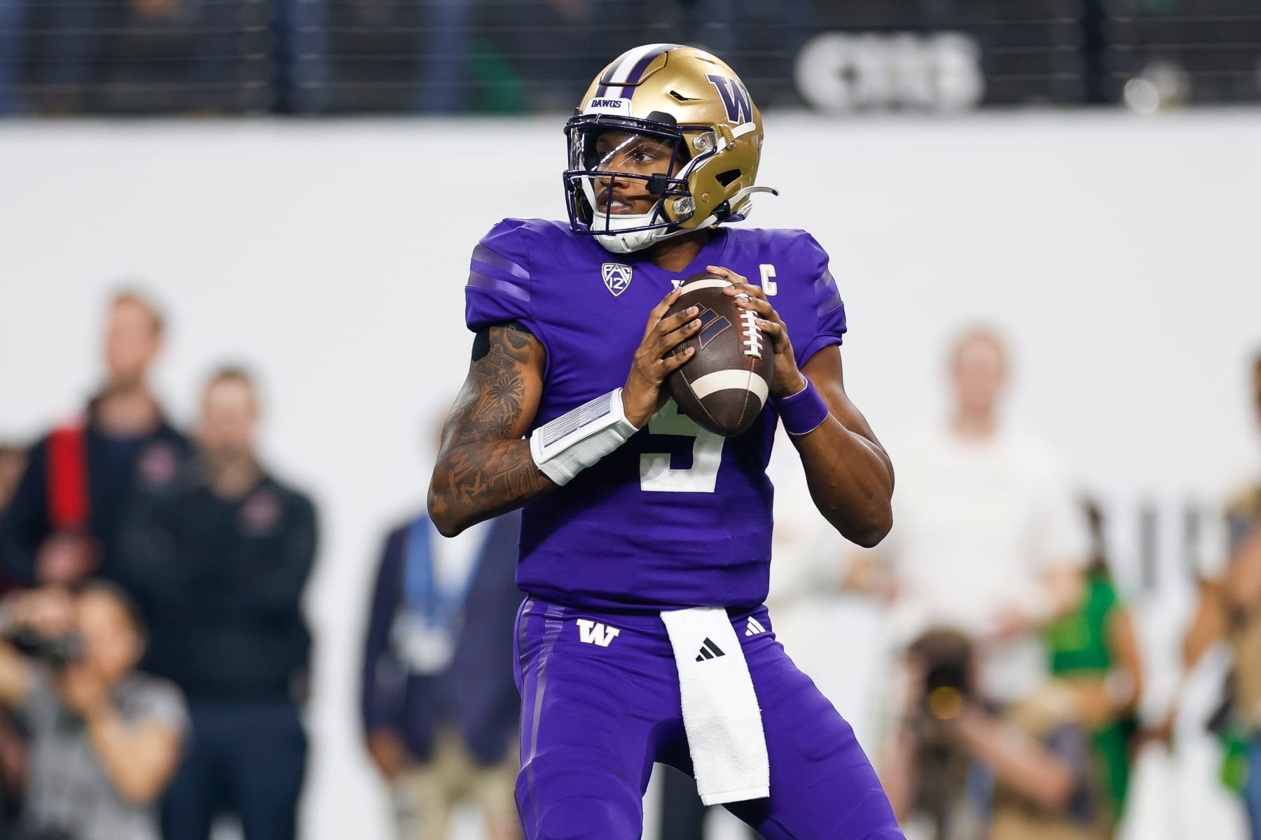 LAS VEGAS, NEVADA - DECEMBER 1: Michael Penix Jr. #9 of the Washington Huskies drops back to pass during the Pac-12 Championship game against the Oregon Ducks at Allegiant Stadium on December 1, 2023 in Las Vegas, Nevada. (Photo by Brandon Sloter/Image Of Sport/Getty Images)