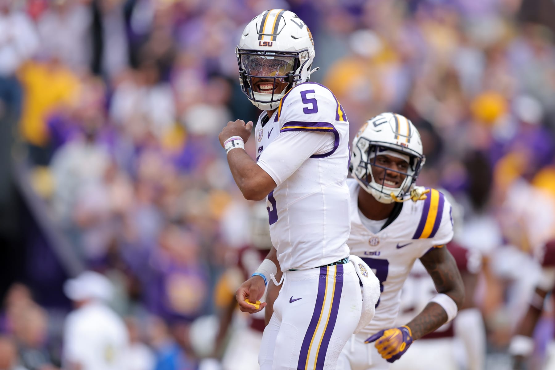 BATON ROUGE, LOUISIANA - NOVEMBER 25: Jayden Daniels #5 of the LSU Tigers celebrates a touchdown during a game against the Texas A&M Aggies at Tiger Stadium on November 25, 2023 in Baton Rouge, Louisiana. (Photo by Jonathan Bachman/Getty Images)