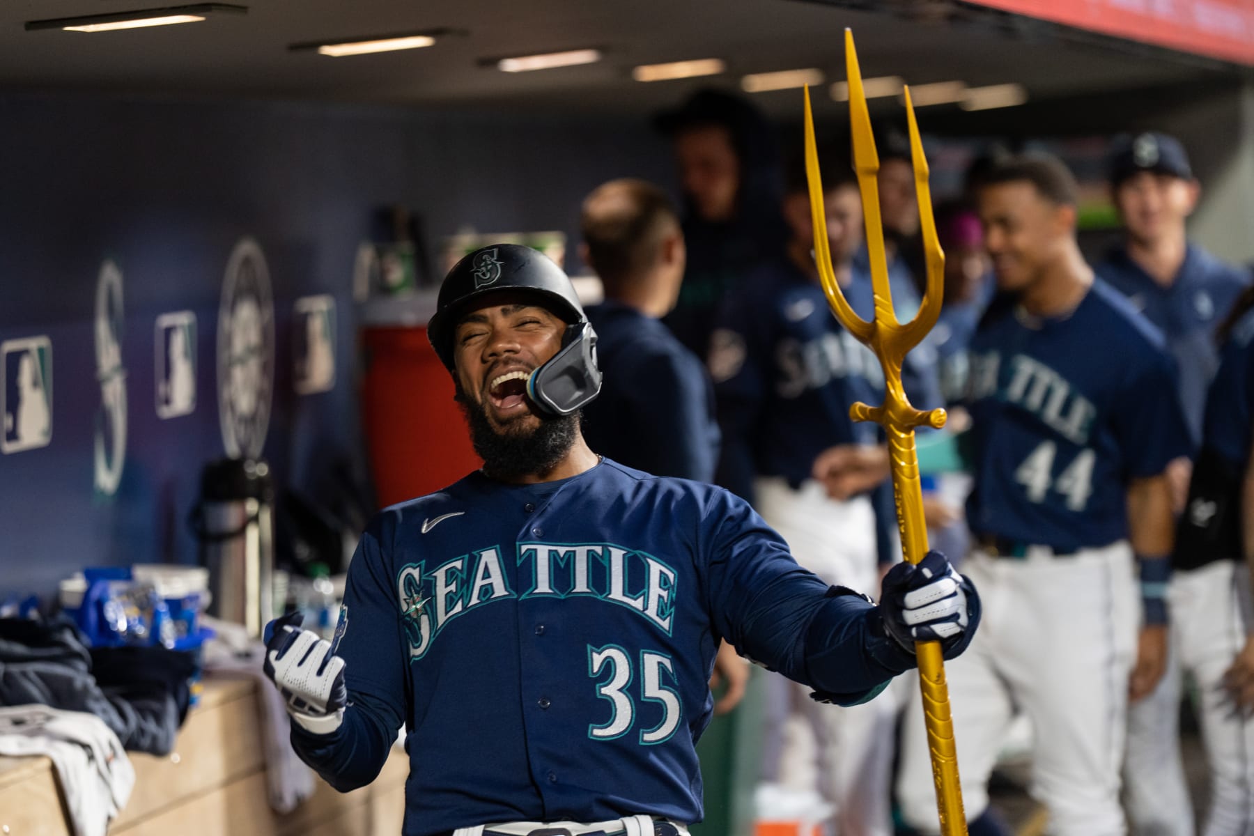 SEATTLE, WA - MAY 24: Teoscar Hernandez #35 of the Seattle Mariners celebrates in the dugout after hitting a solo home run during the seventh inning against the Oakland Athletics at T-Mobile Park on May 24, 2023 in Seattle, Washington. (Photo by Stephen Brashear/Getty Images)