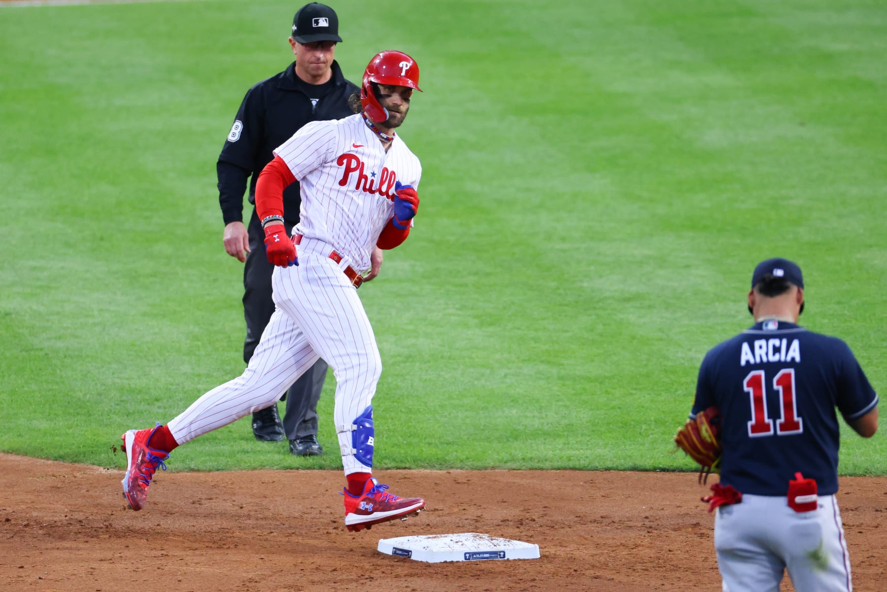 PHILADELPHIA, PA - OCTOBER 11:  Bryce Harper #3 of the Philadelphia Phillies stares back at Orlando Arcia #11 of the Atlanta Braves during Game 3 of the NLDS on October 11, 2023 at Citizens Bank Park in Philadelphia, Pennsylvania.  (Photo by Rich Graessle/Icon Sportswire via Getty Images)