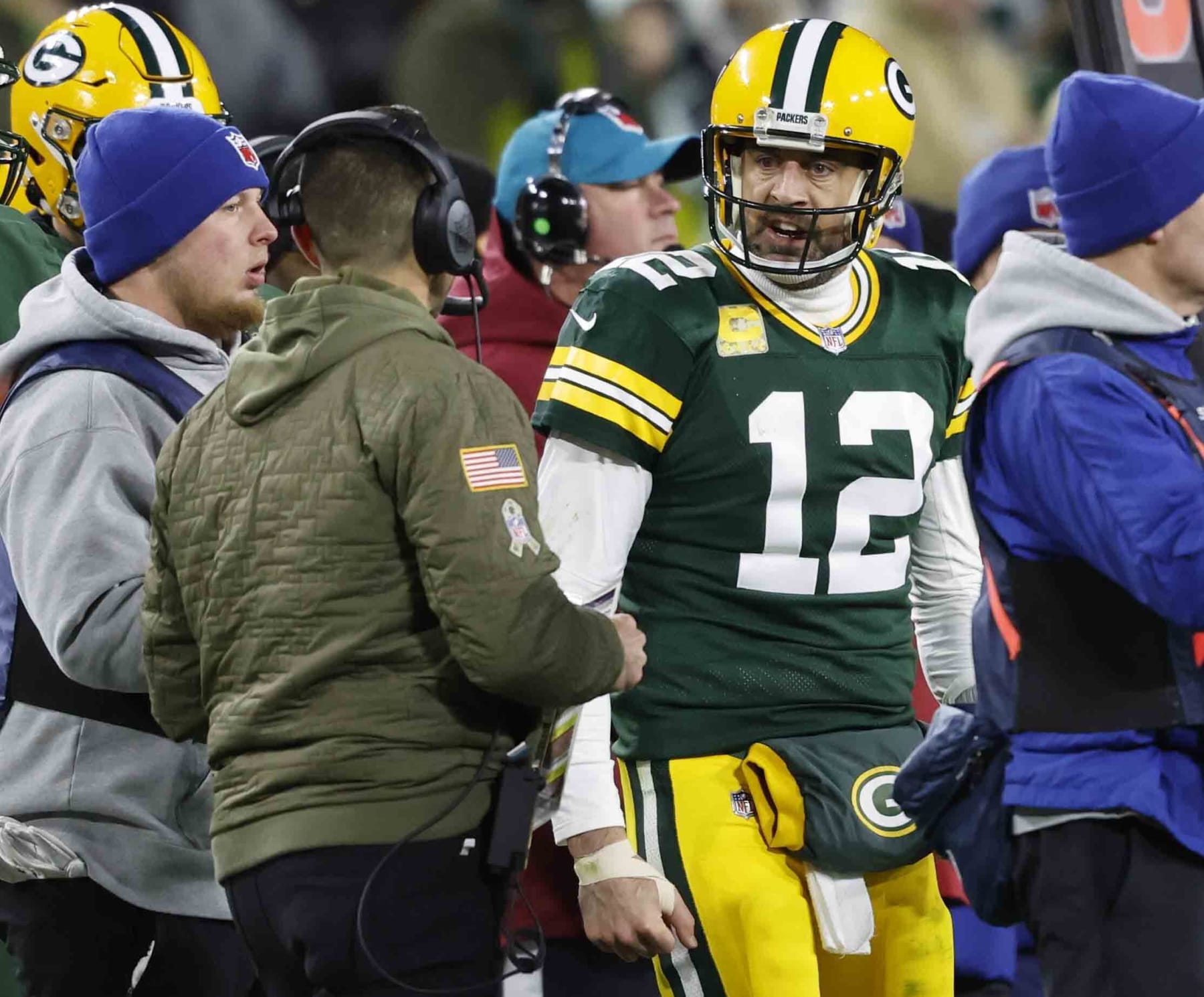 Green Bay Packers quarterback Aaron Rodgers (12) yells at Head coach Matt LaFleur after the last play in regulation against the Dallas Cowboys during an NFL football game Sunday, Nov. 13, 2022, in Green Bay, Wis. (AP Photo/Jeffrey Phelps)