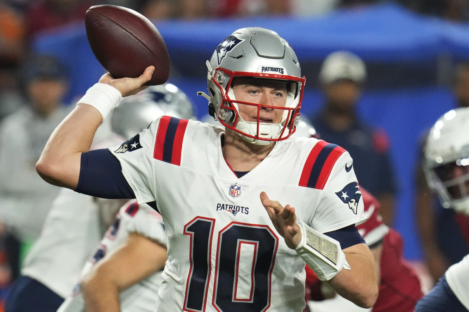 New England Patriots quarterback Mac Jones (10) throws against the Arizona Cardinals during the first half of an NFL football game, Monday, Dec. 12, 2022, in Glendale, Ariz. (AP Photo/Ross D. Franklin)