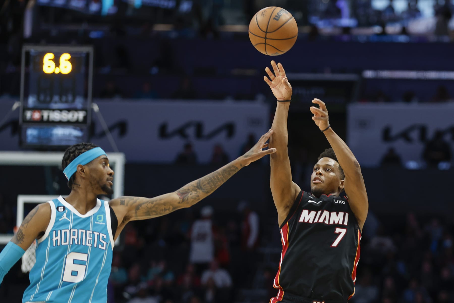 Miami Heat guard Kyle Lowry (7) shoots over Charlotte Hornets forward Jalen McDaniels during the second half of an NBA basketball game in Charlotte, N.C., Sunday, Jan. 29, 2023. Charlotte won 122-117. (AP Photo/Nell Redmond)