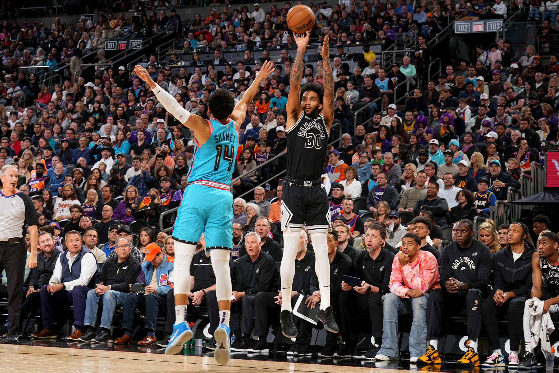PHOENIX, AZ - APRIL 4: Julian Champagnie #30 of the San Antonio Spurs shoots a three point basket during the game against the Phoenix Suns on April 4, 2023 at Footprint Center in Phoenix, Arizona. NOTE TO USER: User expressly acknowledges and agrees that, by downloading and or using this photograph, user is consenting to the terms and conditions of the Getty Images License Agreement. Mandatory Copyright Notice: Copyright 2023 NBAE (Photo by Garrett Ellwood/NBAE via Getty Images)
