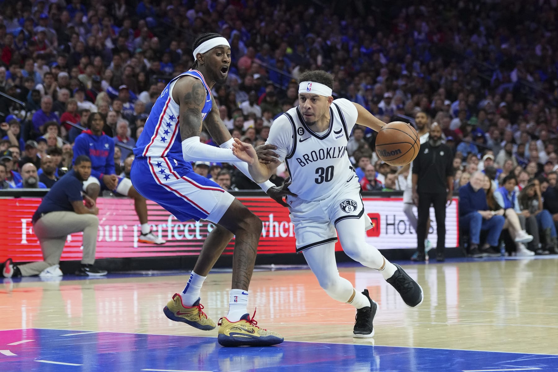 PHILADELPHIA, PA - APRIL 17: Seth Curry #30 of the Brooklyn Nets drives to the basket against Jalen McDaniels #7 of the Philadelphia 76ers during Game Two of the Eastern Conference First Round Playoffs at the Wells Fargo Center on April 17, 2023 in Philadelphia, Pennsylvania. NOTE TO USER: User expressly acknowledges and agrees that, by downloading and or using this photograph, User is consenting to the terms and conditions of the Getty Images License Agreement. (Photo by Mitchell Leff/Getty Images)