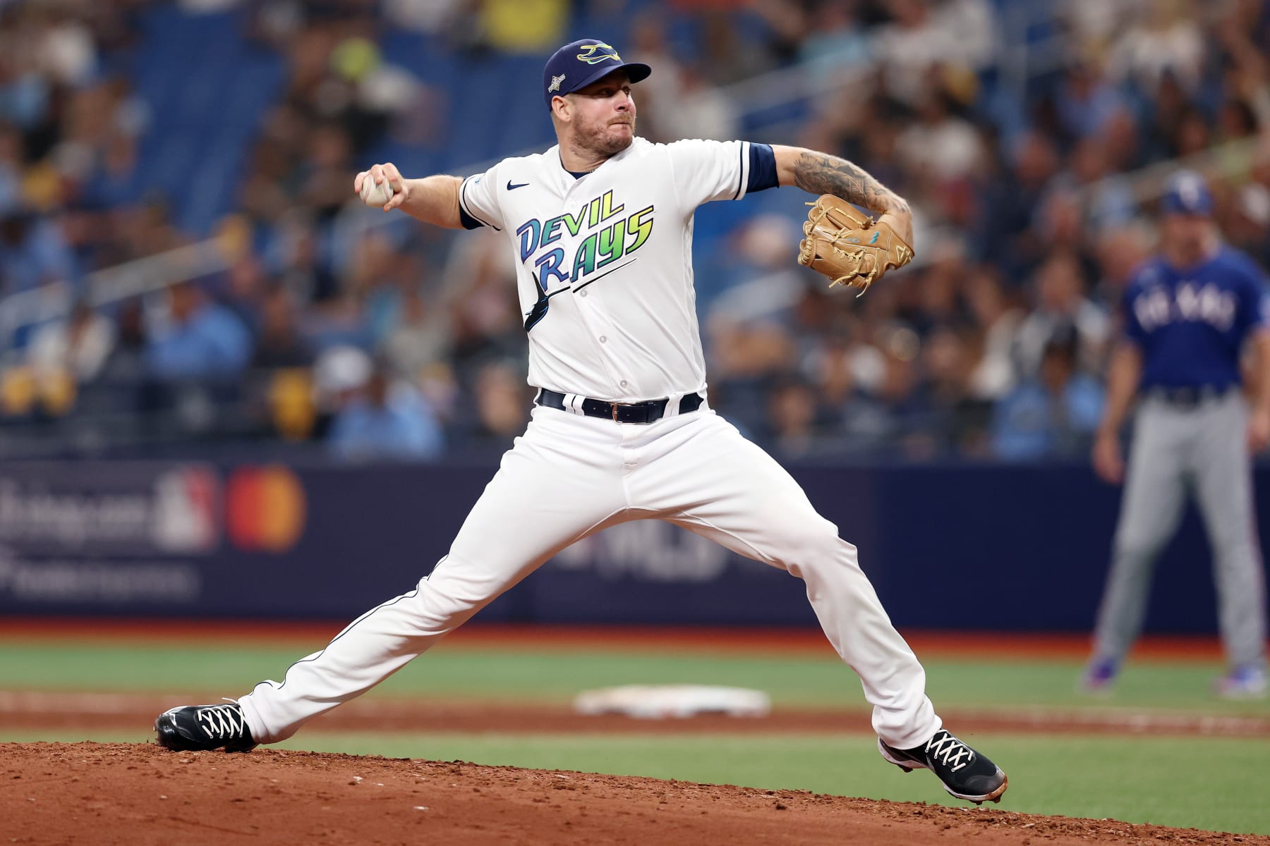 ST PETERSBURG, FLORIDA - OCTOBER 03: Chris Devenski #48 of the Tampa Bay Rays pitches in the sixth inning against the Texas Rangers during Game One of the Wild Card Series at Tropicana Field on October 03, 2023 in St Petersburg, Florida. (Photo by Megan Briggs/Getty Images)