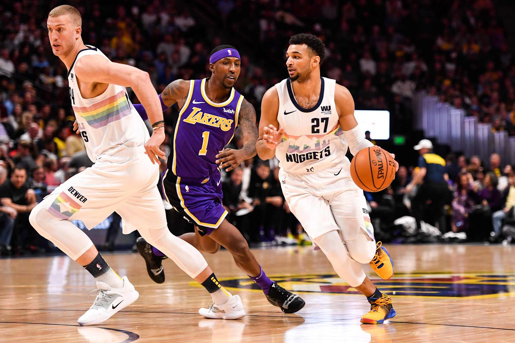 DENVER, CO - NOVEMBER 27: Jamal Murray (27) of the Denver Nuggets drives on Kentavious Caldwell-Pope (1) of the Los Angeles Lakers as Mason Plumlee (24) of the Denver Nuggets rolls during the first half on Tuesday, November 27, 2018. The Denver Nuggets hosted the Los Angeles Lakers at the Pepsi Center. (Photo by AAron Ontiveroz/The Denver Post via Getty Images)