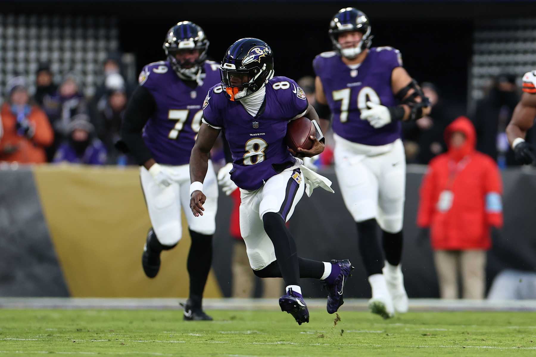 BALTIMORE, MARYLAND - JANUARY 04: Lamar Jackson #8 of the Baltimore Ravens runs with the ball during the first quarter against the Cleveland Browns at M&T Bank Stadium on January 04, 2025 in Baltimore, Maryland. (Photo by Scott Taetsch/Getty Images)