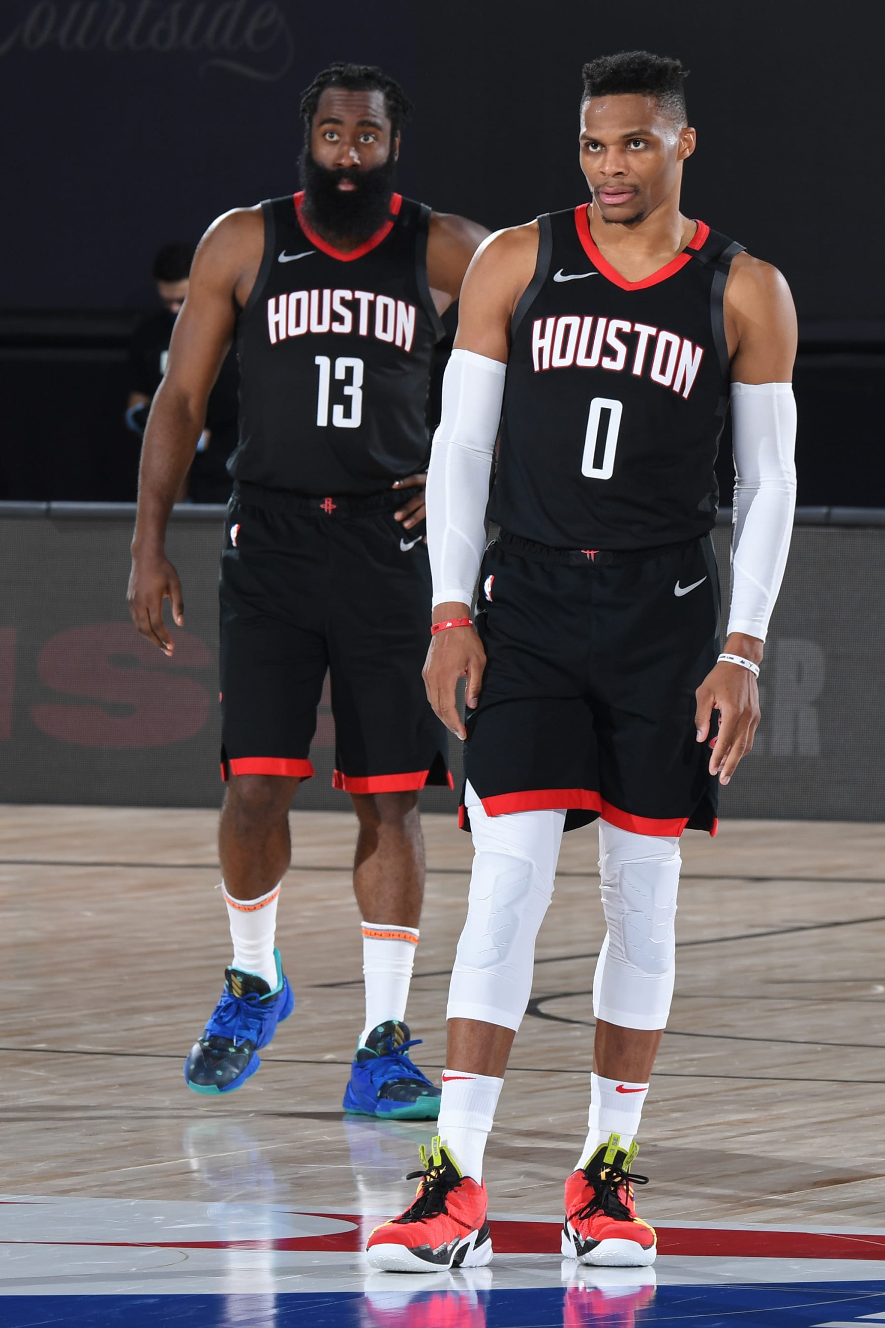 Orlando, FL - SEPTEMBER 12: James Harden #13 of the Houston Rockets and Russell Westbrook #0 of the Houston Rockets look on during the game against the Los Angeles Lakers during Game Five of the Western Conference Semifinals on September 12, 2020 in Orlando, Florida at AdventHealth Arena. NOTE TO USER: User expressly acknowledges and agrees that, by downloading and/or using this Photograph, user is consenting to the terms and conditions of the Getty Images License Agreement. Mandatory Copyright Notice: Copyright 2020 NBAE (Photo by Andrew D. Bernstein/NBAE via Getty Images)