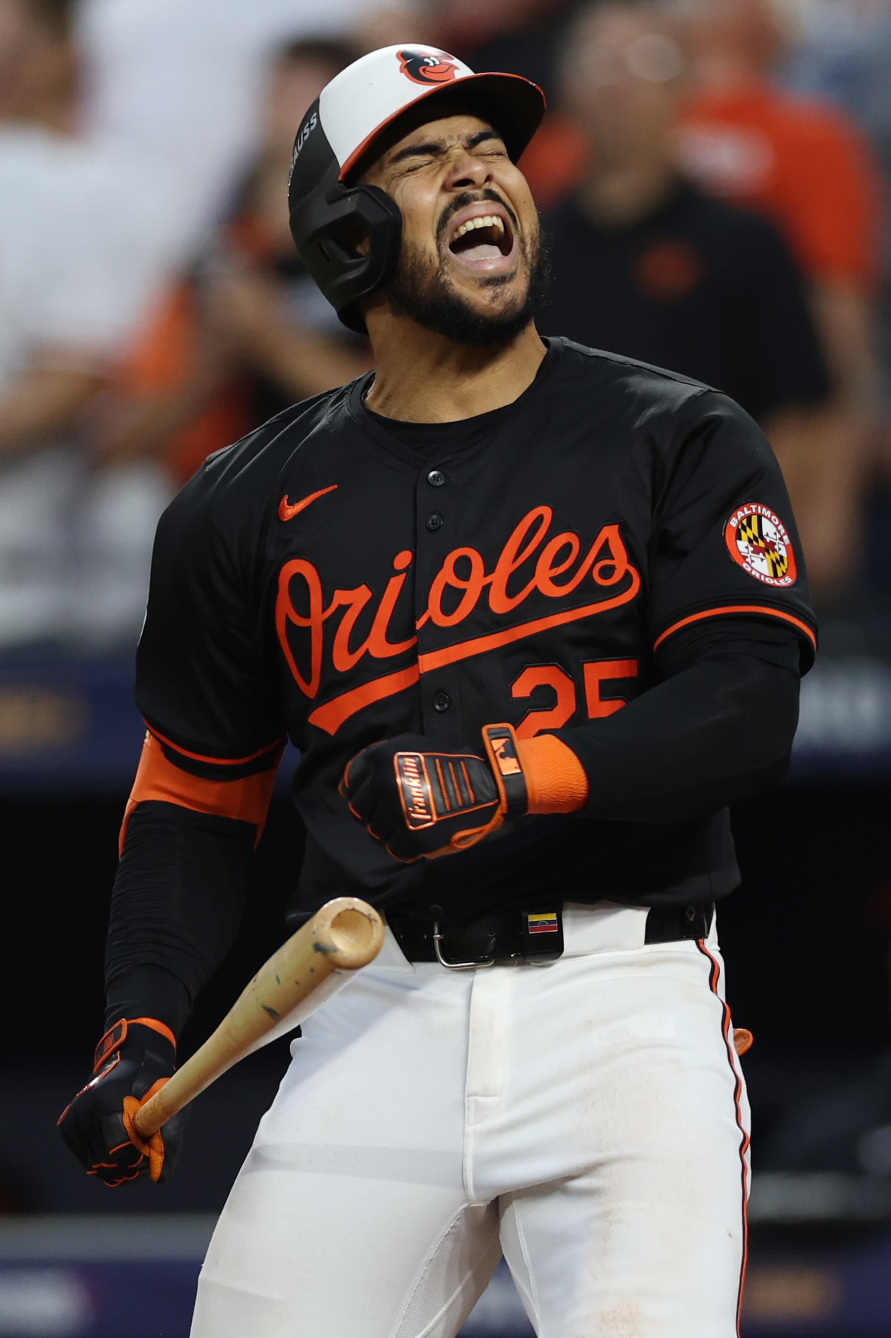 BALTIMORE, MARYLAND - OCTOBER 02: Anthony Santander #25 of the Baltimore Orioles reacts after flying out against the Kansas City Royals with the bases loaded during the fifth inning of Game Two of the Wild Card Series at Oriole Park at Camden Yards on October 02, 2024 in Baltimore, Maryland.  (Photo by Patrick Smith/Getty Images)