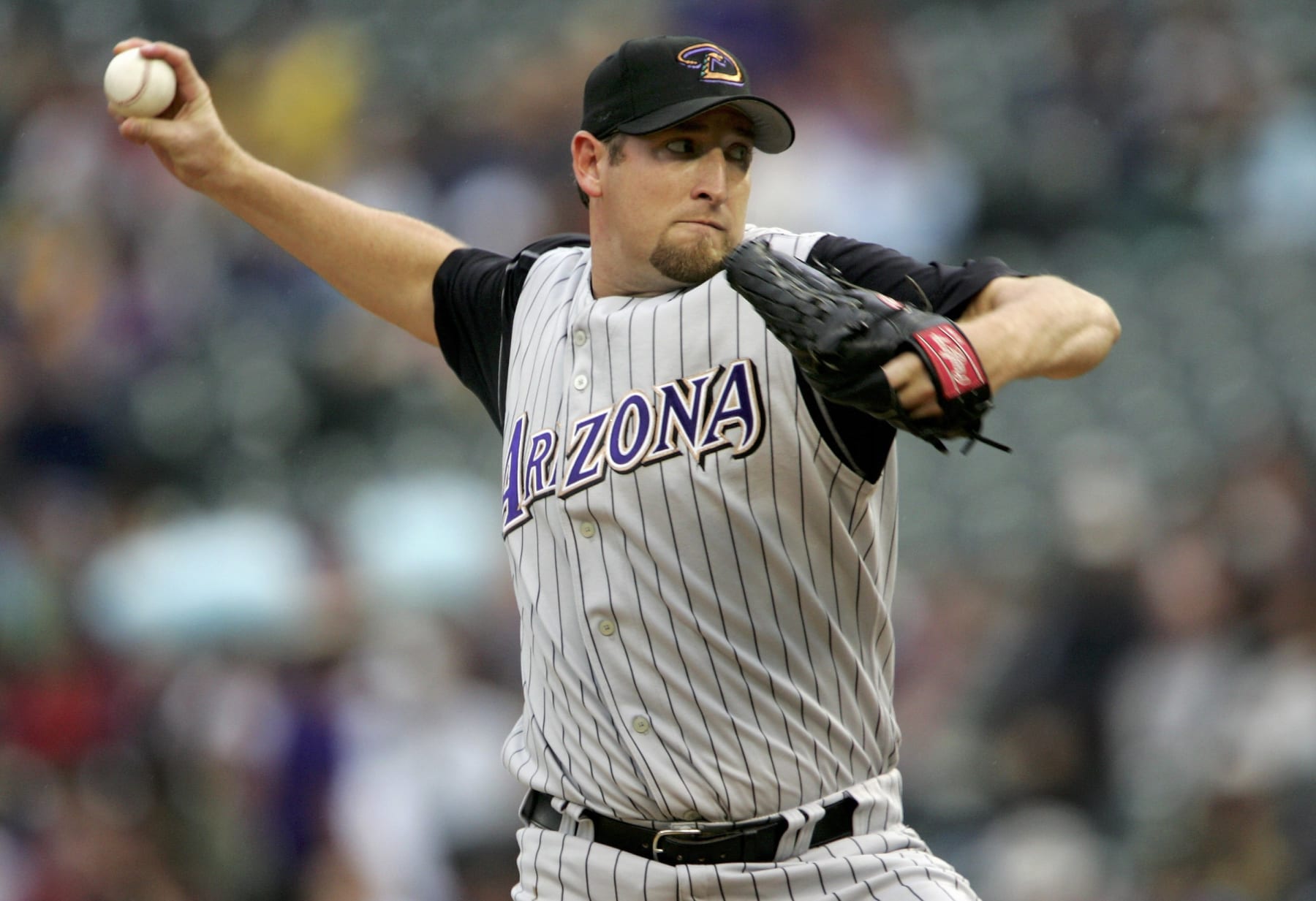 DENVER - JULY 08:  Starting pitcher Brandon Webb #17 of the Arizona Diamondbacks delivers against the Colorado Rockies at Coors Field on July 8, 2006 in Denver, Colorado.  (Photo by Doug Pensinger/Getty Images)
