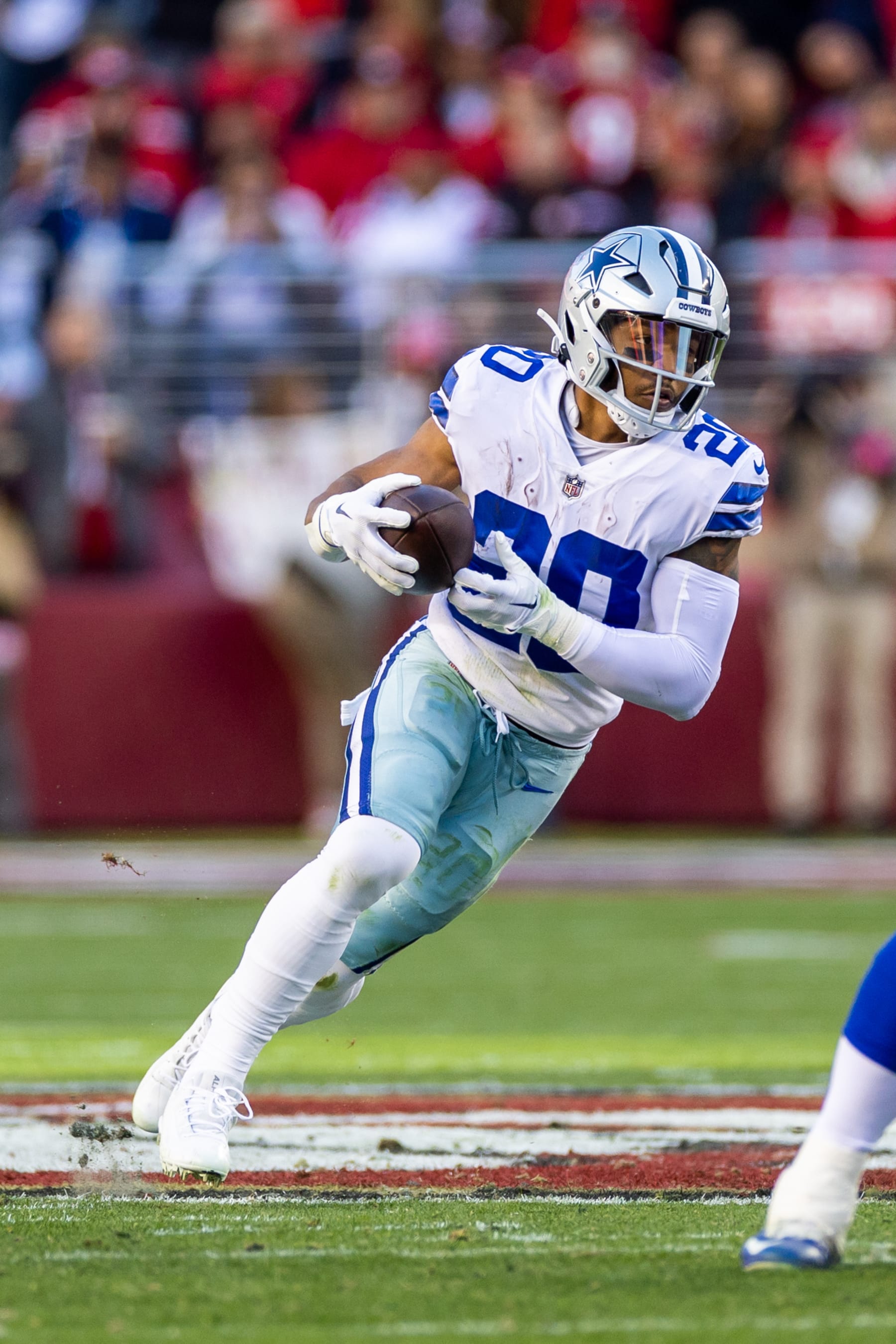 SANTA CLARA, CA - JANUARY 22: Dallas Cowboys running back Tony Pollard (20) runs through a hole during the NFL NFC Divisional Playoff game between the Dallas Cowboys and San Francisco 49ers at Levis Stadium in Santa Clara, CA. (Photo by Bob Kupbens/Icon Sportswire via Getty Images)