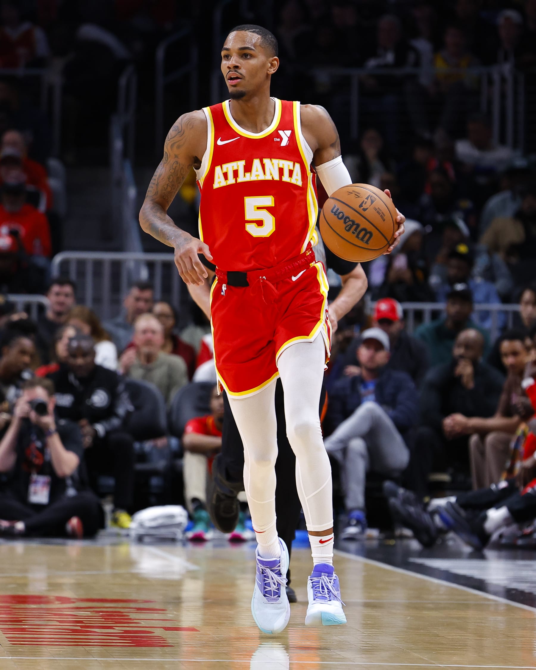 ATLANTA, GEORGIA - JANUARY 3: Dejounte Murray #5 of the Atlanta Hawks looks to pass during the second half against the Oklahoma City Thunder at State Farm Arena on January 3, 2024 in Atlanta, Georgia. NOTE TO USER: User expressly acknowledges and agrees that, by downloading and or using this photograph, User is consenting to the terms and conditions of the Getty Images License Agreement. (Photo by Todd Kirkland/Getty Images)