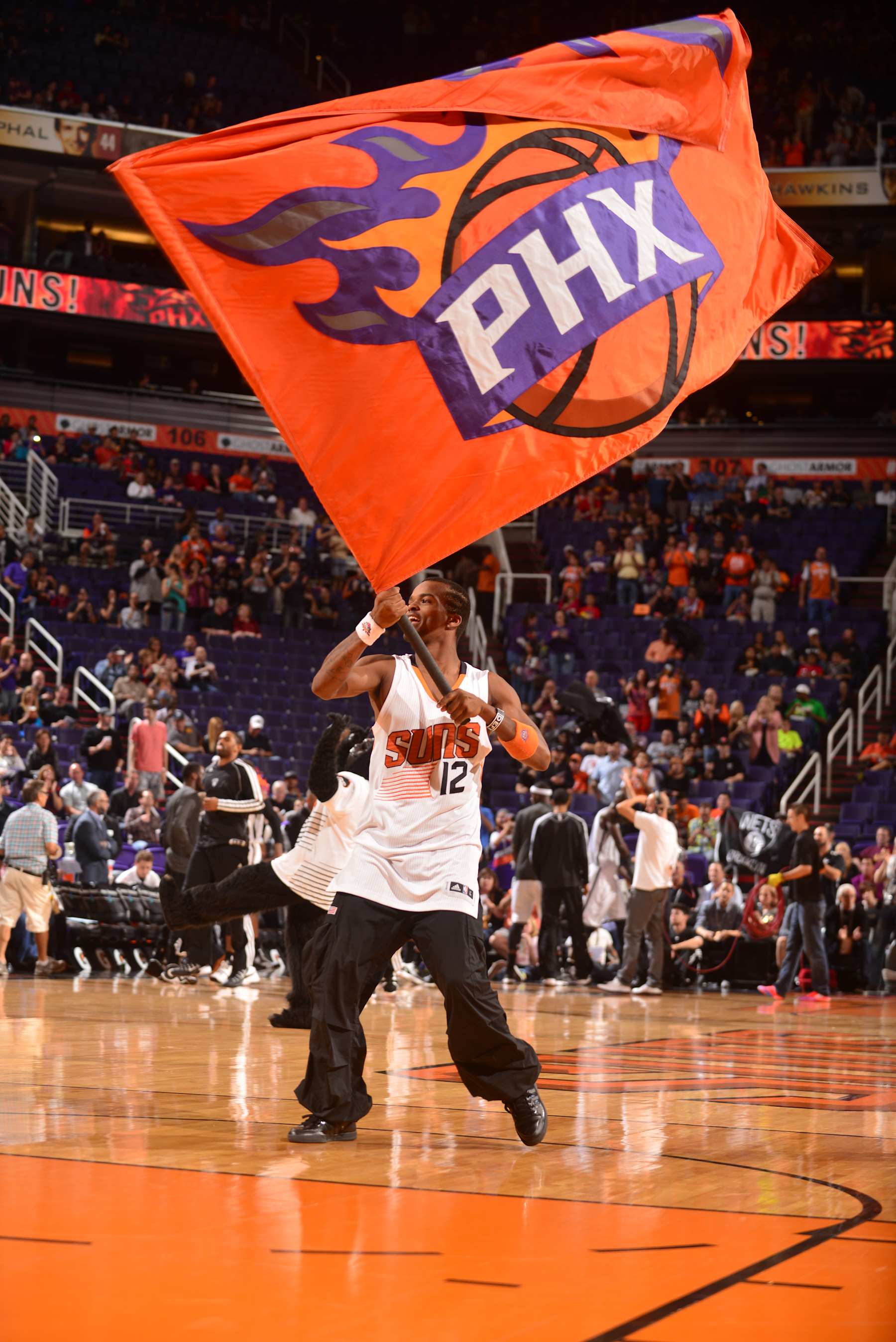 PHOENIX, AZ - NOVEMBER 15: The logo of the Phoenix Suns is waved to get the crowd pumped up against the Brooklyn Nets on November 15, 2013 at U.S. Airways Center in Phoenix, Arizona. NOTE TO USER: User expressly acknowledges and agrees that, by downloading and or using this photograph, user is consenting to the terms and conditions of the Getty Images License Agreement. Mandatory Copyright Notice: Copyright 2013 NBAE (Photo by Barry Gossage/NBAE via Getty Images)