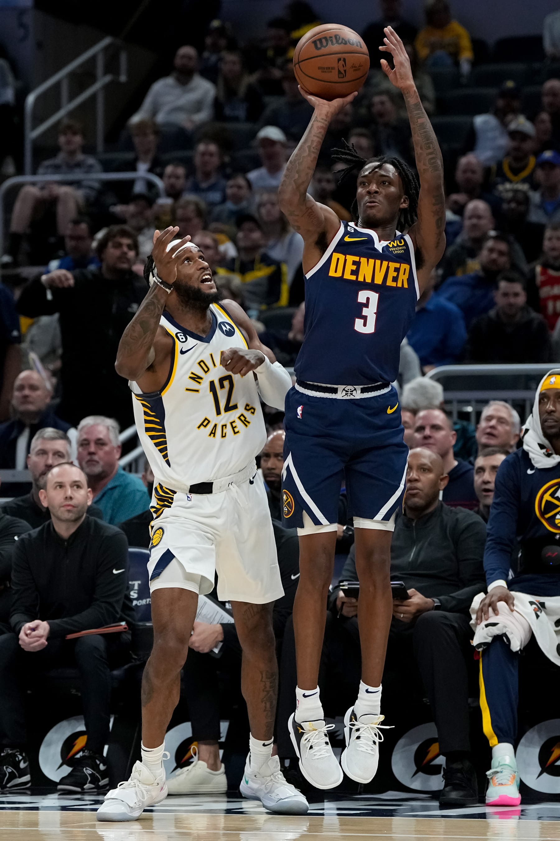 INDIANAPOLIS, INDIANA - NOVEMBER 09: Bones Hyland #3 of the Denver Nuggets attempts a shot while being guarded by Oshae Brissett #12 of the Indiana Pacers in the second quarter at Gainbridge Fieldhouse on November 09, 2022 in Indianapolis, Indiana. NOTE TO USER: User expressly acknowledges and agrees that, by downloading and or using this photograph, User is consenting to the terms and conditions of the Getty Images License Agreement. (Photo by Dylan Buell/Getty Images)