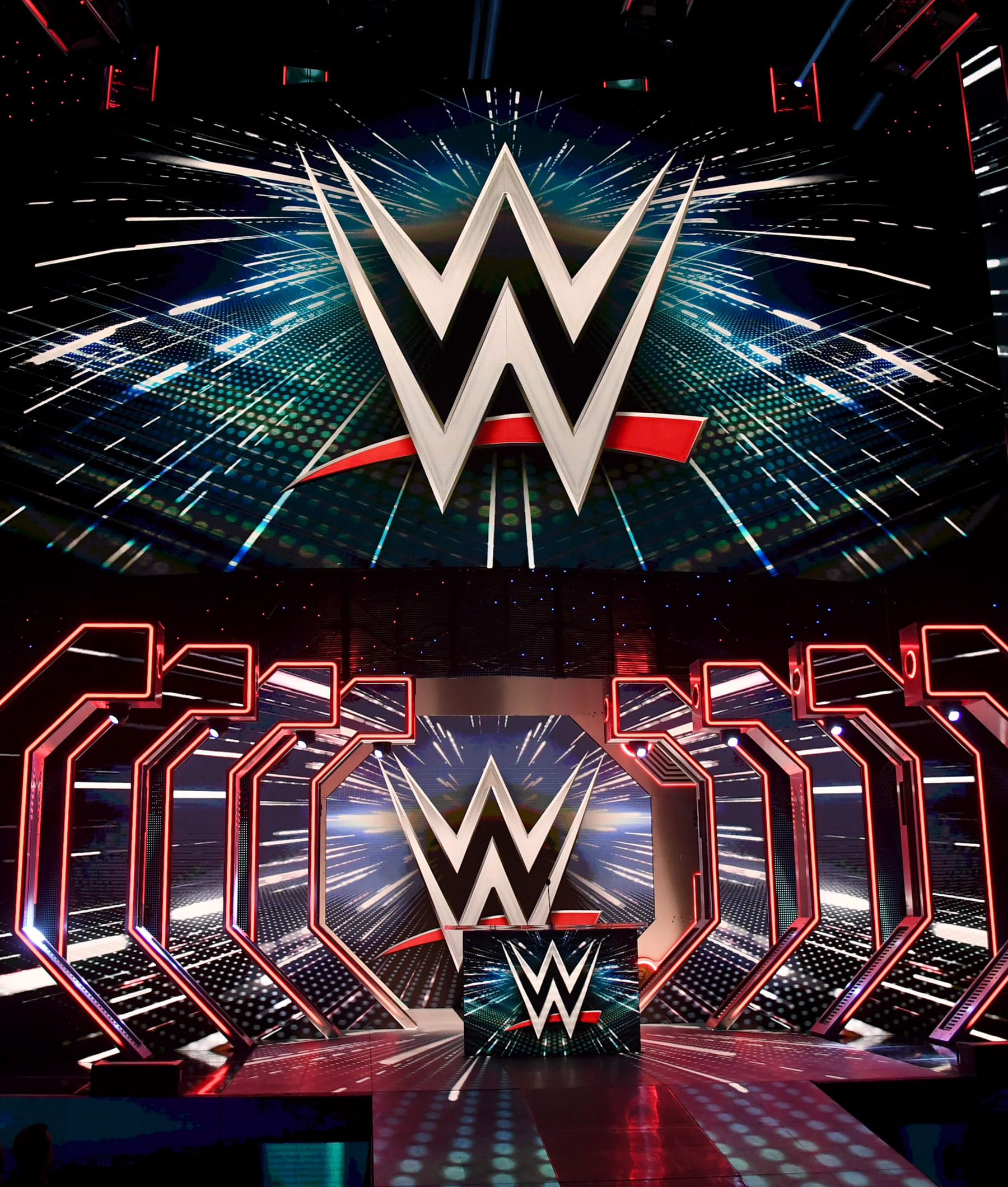 LAS VEGAS, NEVADA - OCTOBER 11:  WWE logos are shown on screens before a WWE news conference at T-Mobile Arena on October 11, 2019 in Las Vegas, Nevada. It was announced that WWE wrestler Braun Strowman will face heavyweight boxer Tyson Fury and WWE champion Brock Lesnar will take on former UFC heavyweight champion Cain Velasquez at the WWE's Crown Jewel event at Fahd International Stadium in Riyadh, Saudi Arabia on October 31.  (Photo by Ethan Miller/Getty Images)