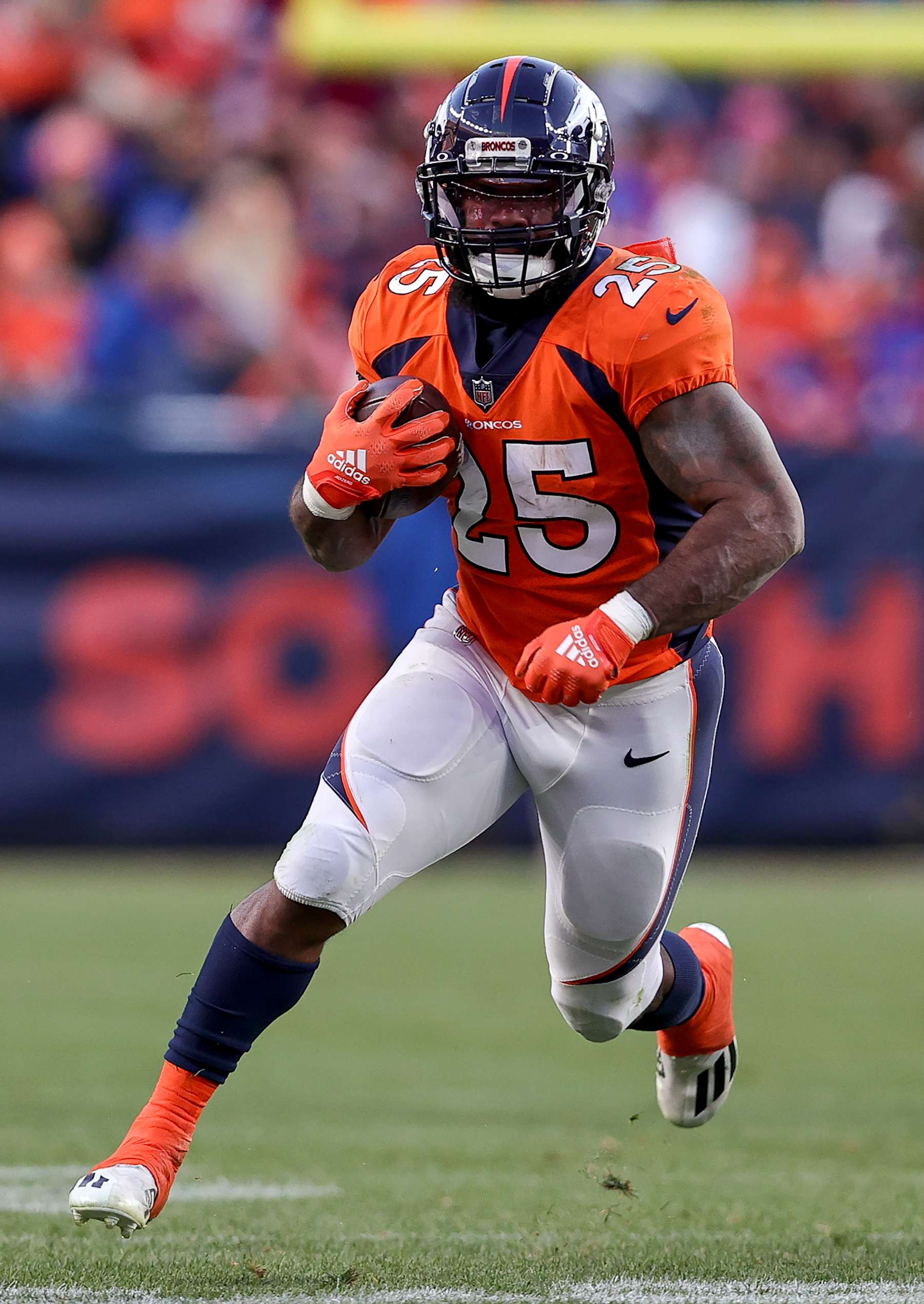 DENVER, CO - NOVEMBER 26: Denver Broncos running back Samaje Perine finds a nice hole to run during an NFL game between the Cleveland Browns and the Denver Broncos on November 26, 2023 at Empower Field at Mile High in Denver, CO. (Photo by Steve Nurenberg/Icon Sportswire via Getty Images)