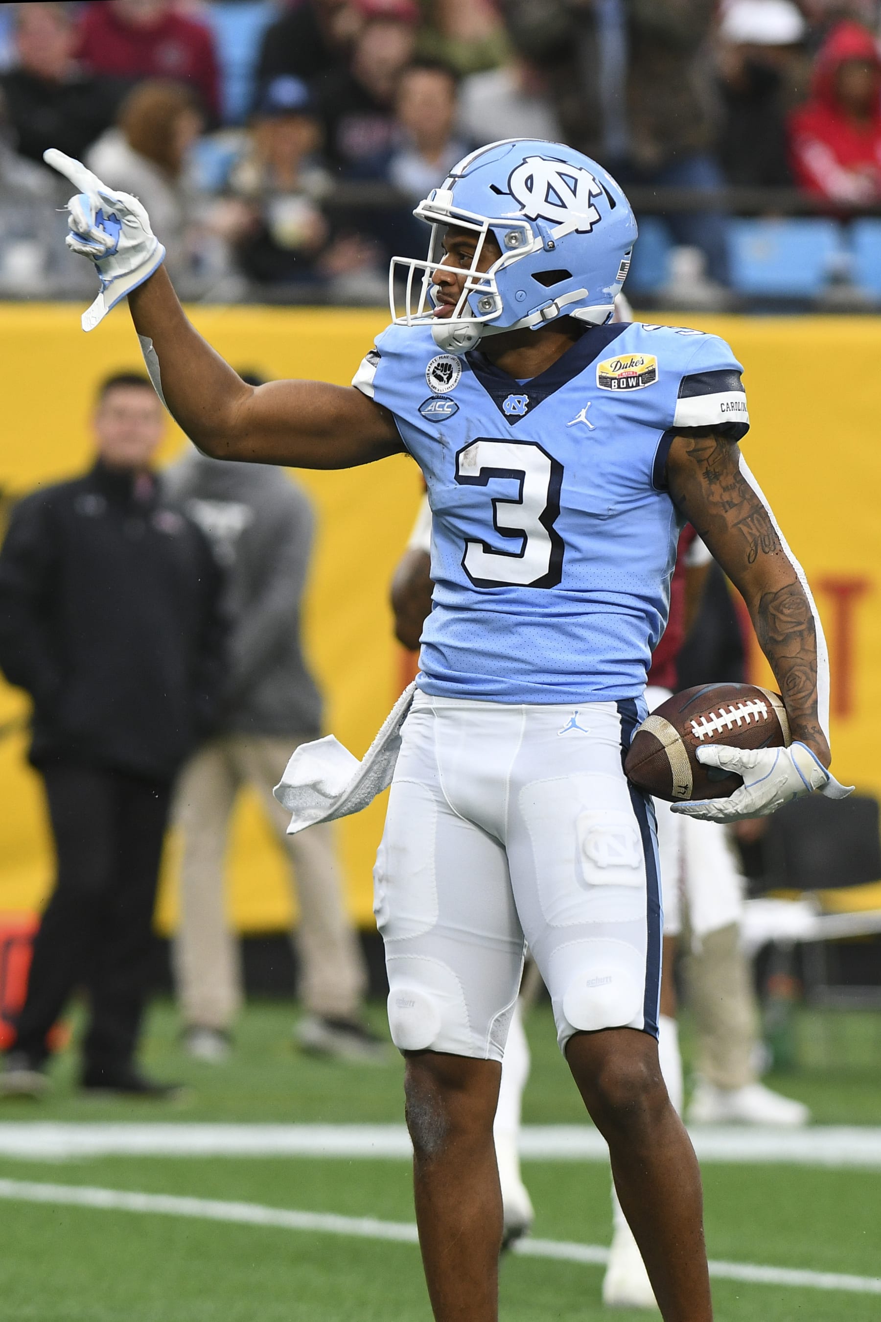 CHARLOTTE, NC - DECEMBER 30: North Carolina Tar Heels wide receiver Antoine Green (3) signals first down after the play during the Dukes Mayo Bowl game between the South Carolina Gamecocks and the North Carolina Tar Heels on December 30,2021 at Bank of America Stadium in Charlotte,NC. (Photo by Dannie Walls/Icon Sportswire via Getty Images)